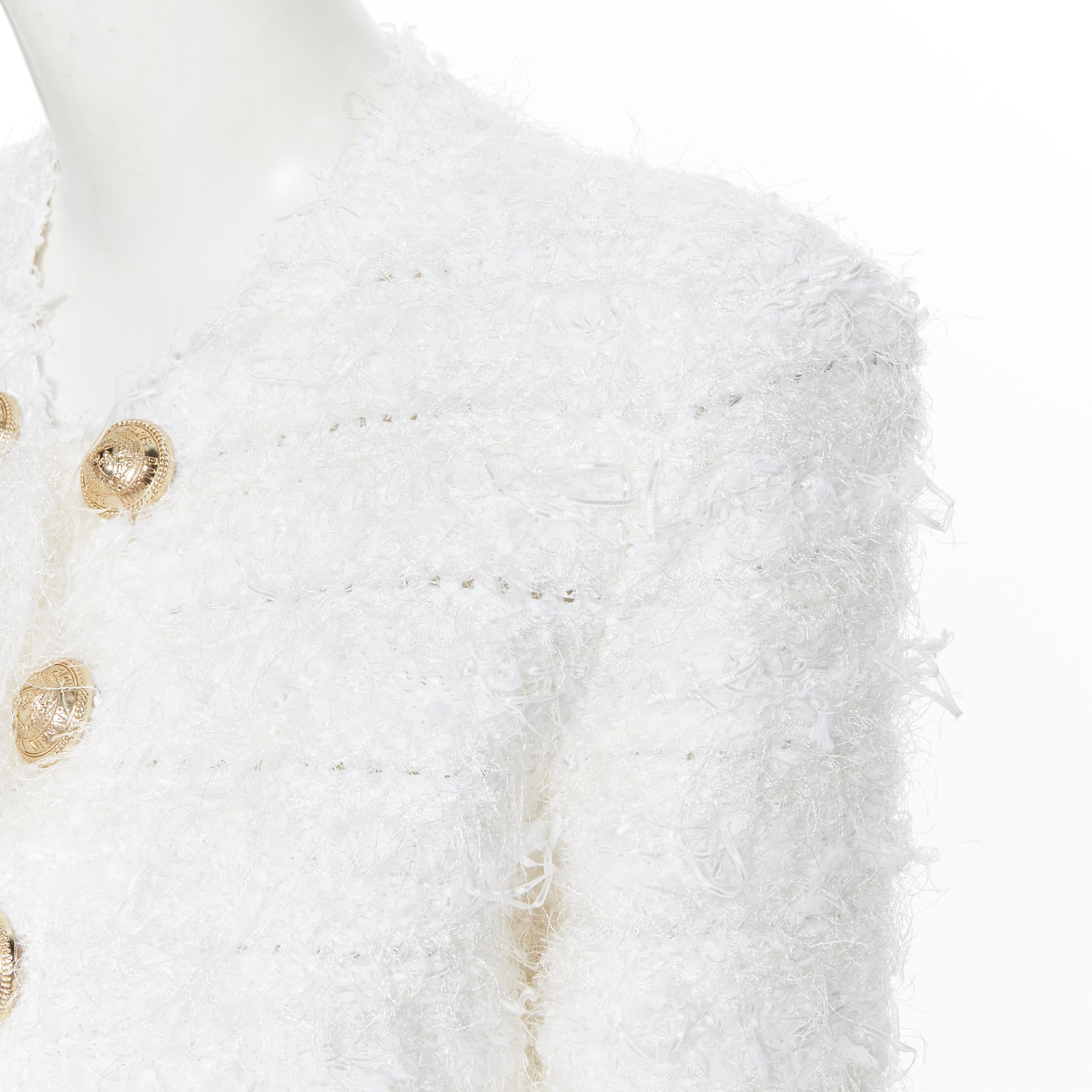 new BALMAIN white boucle double breasted fringe military cardigan jacket FR36 S
Brand: Balmain
Designer: Olivier Rousteing
Model Name / Style: Double breasted jacket
Material: Viscose blend
Color: White
Pattern: Solid
Closure: Button
Extra Detail: