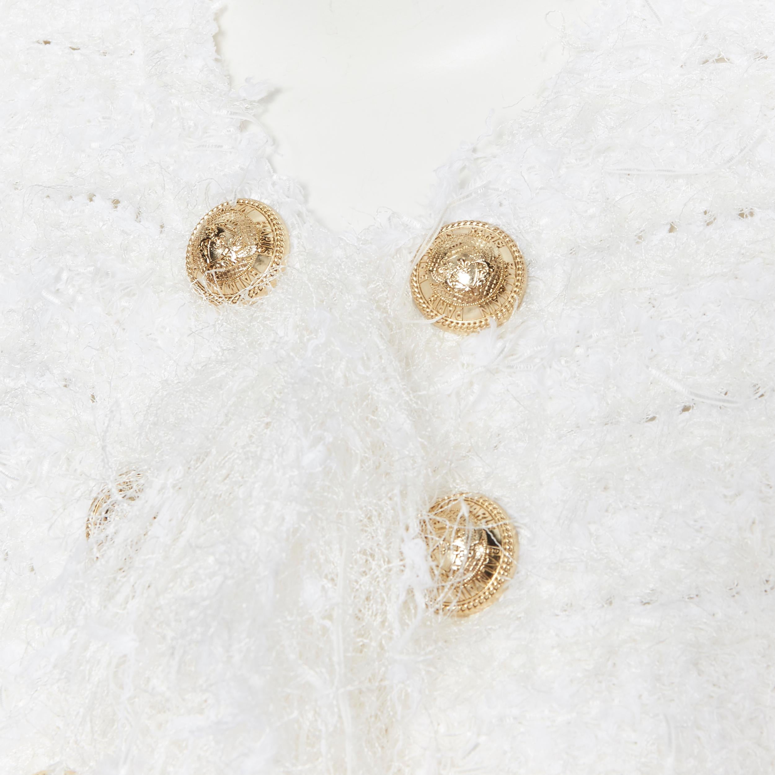 new BALMAIN white boucle tweed gold double breasted fringe cardigan jacket FR36
Brand: Balmain
Designer: Olivier Rousteing
Model Name / Style: Double breasted jacket
Material: Viscose blend
Color: White
Pattern: Solid
Closure: Button
Extra Detail: