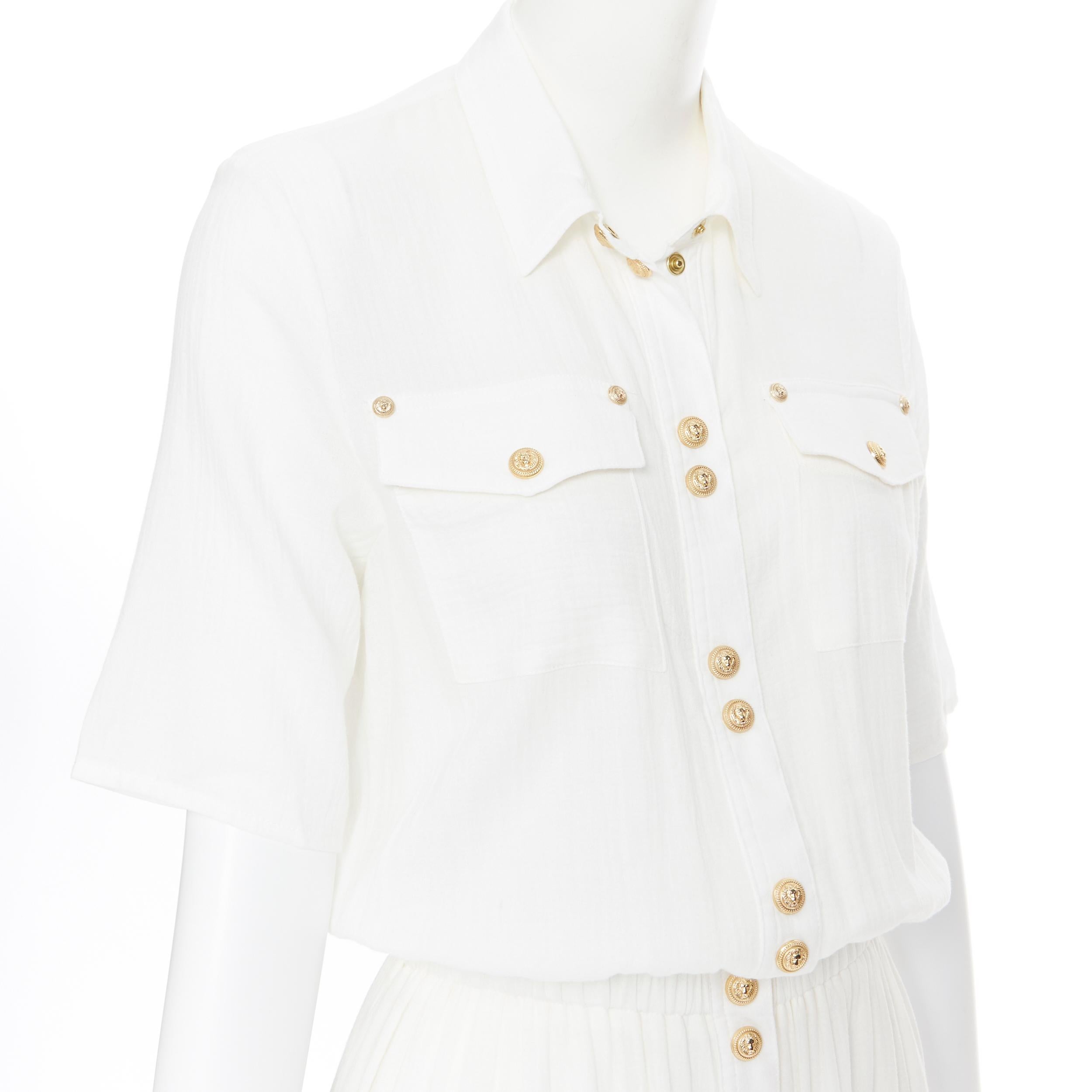 new BALMAIN white fine cotton gold military button cinched waist maxi dress FR34
Brand: Balmain
Designer: Olivier Rousteing
Model Name / Style: Maxi dress
Material: Cotton
Color: White
Pattern: Solid
Closure: Button
Extra Detail: BALMAIN style code: