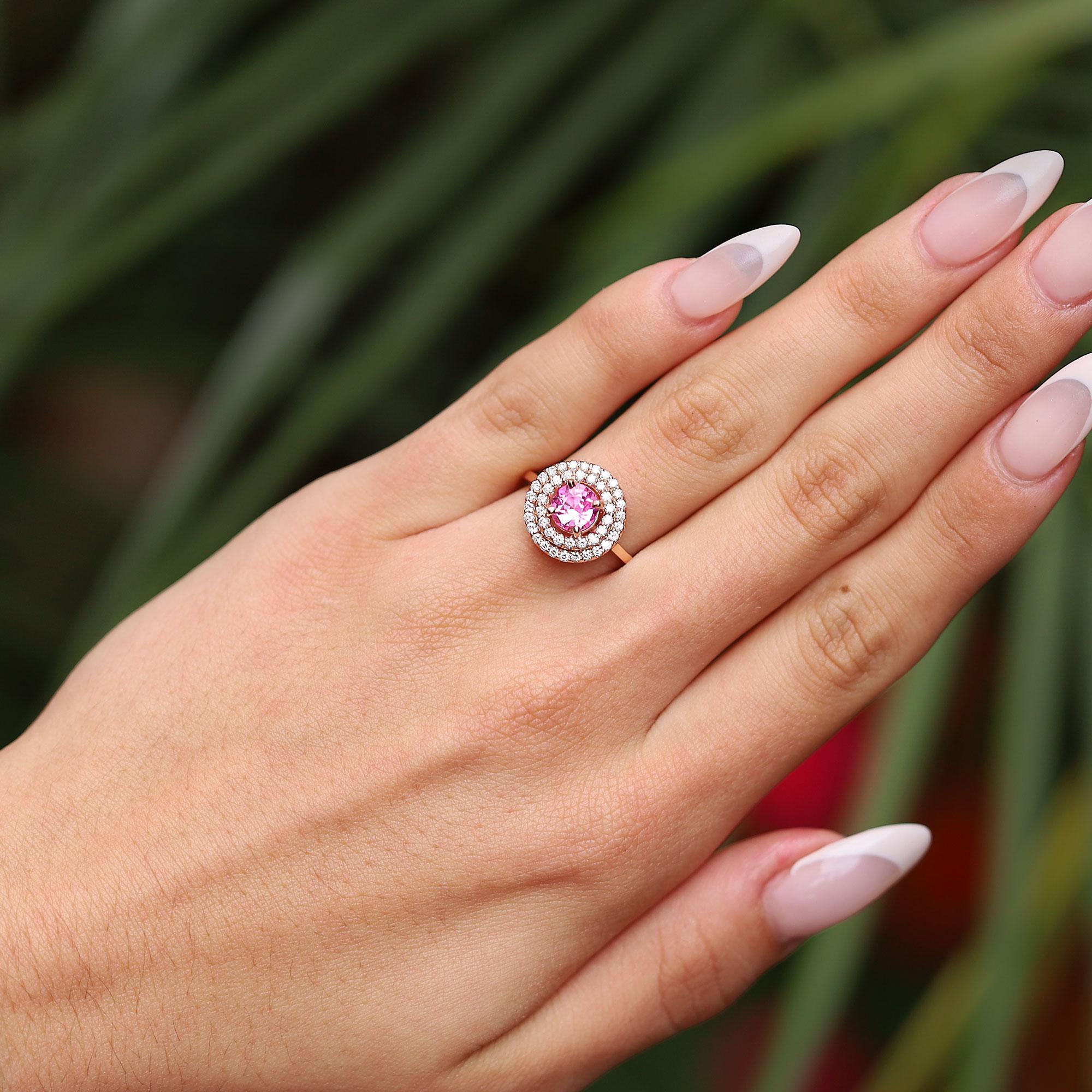 This striking sapphire ring boasts a striking, bubbly, Barbie pink color, perfect for everyday wear. Offered at a spectacular value, this is a fantastic gemstone engagement ring, or right handed statement cocktail ring. With a contemporary rose gold