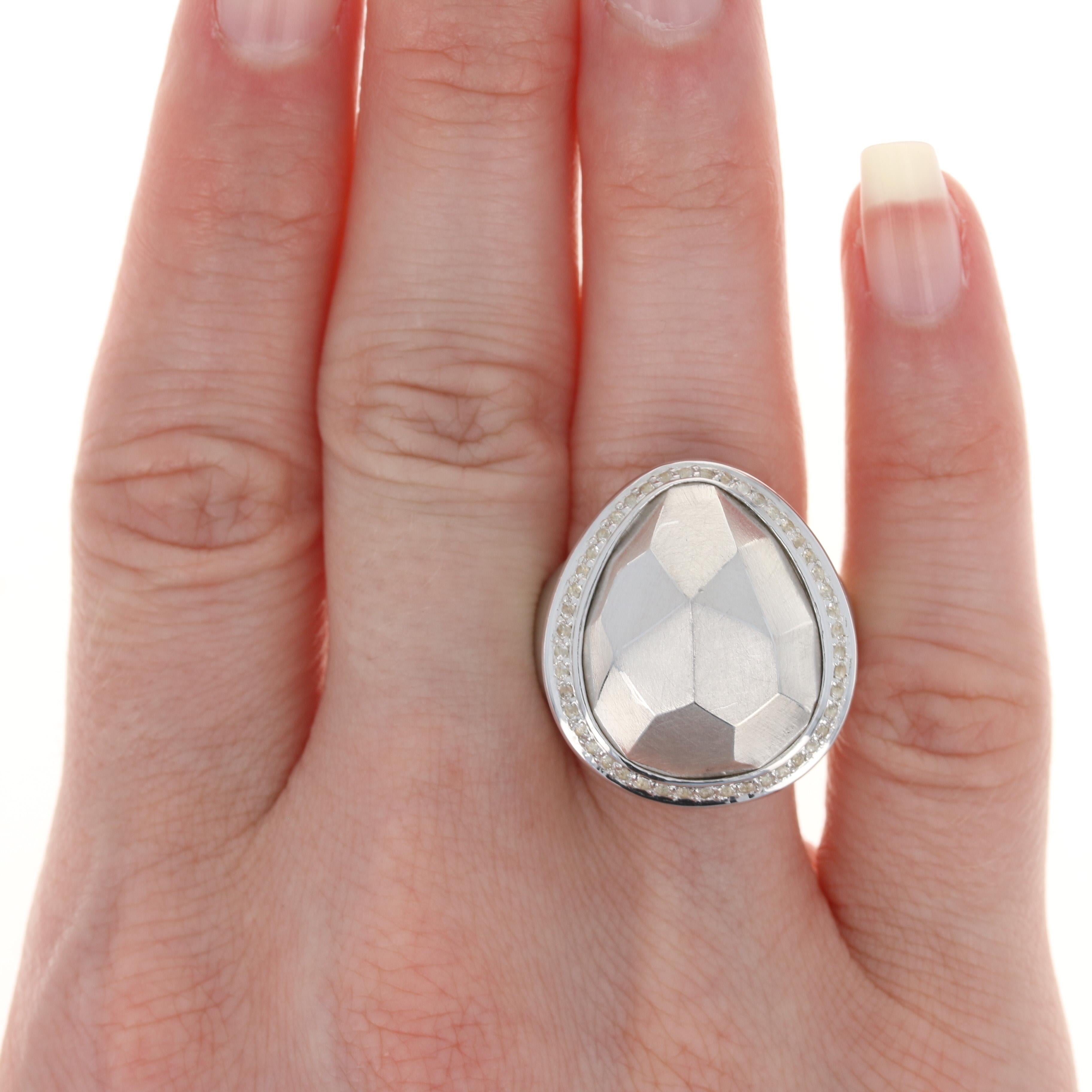 This ring retails at $400
This ring is a size 7 1/2. Please contact for additional sizing options.
Metal Content: Sterling Silver
Finish: Brushed
Stone: White Topaz Halo
Face Height (north to south): 31/32