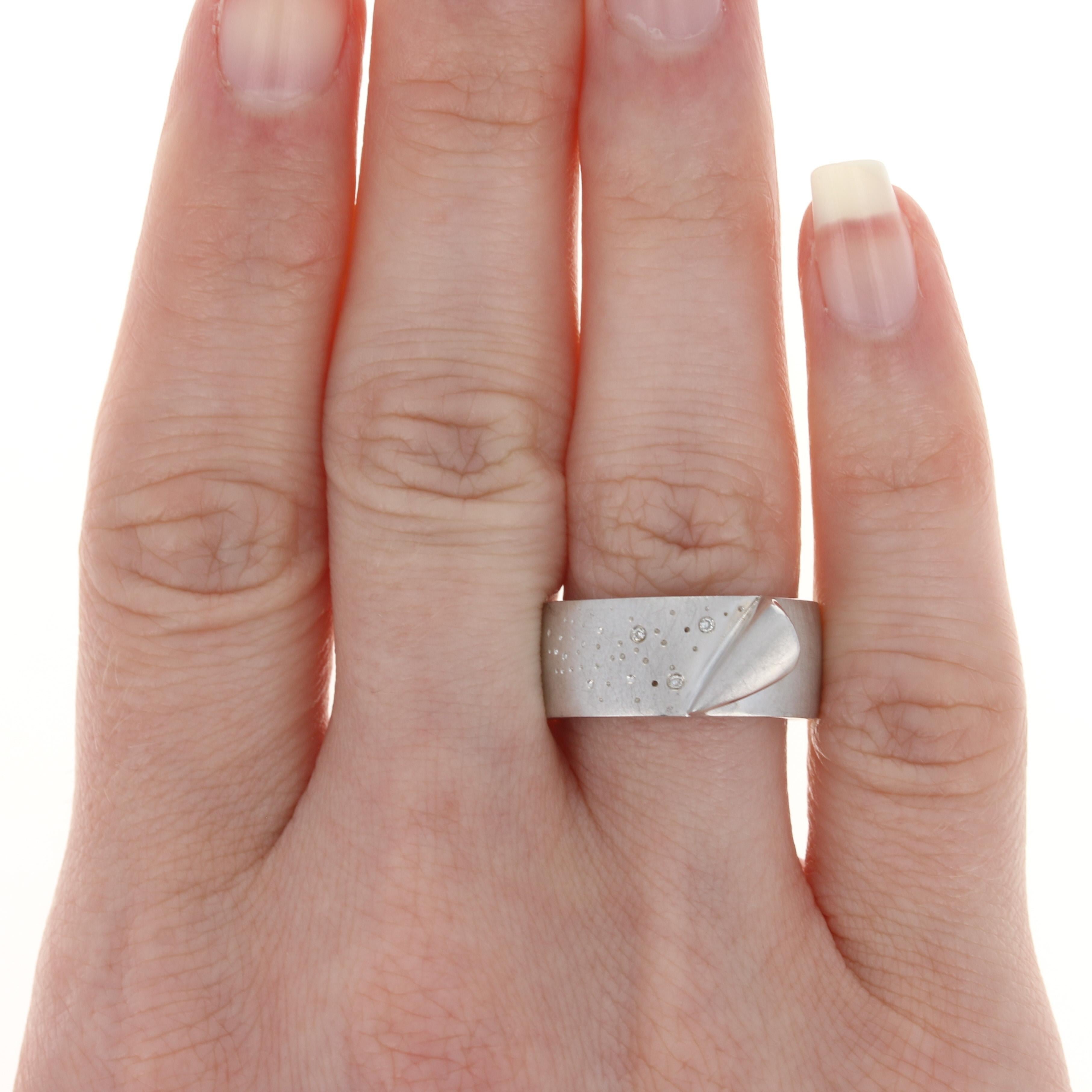 This ring retails at $265 

This ring is a size 7 1/2 - 7 3/4. Please contact for additional sizing options.

Metal Content: Sterling Silver
Finish: Satin

Stone Information:
Natural Diamonds - 
Cut: Round
Total Carats: 0.01ctw 

Face Height (north