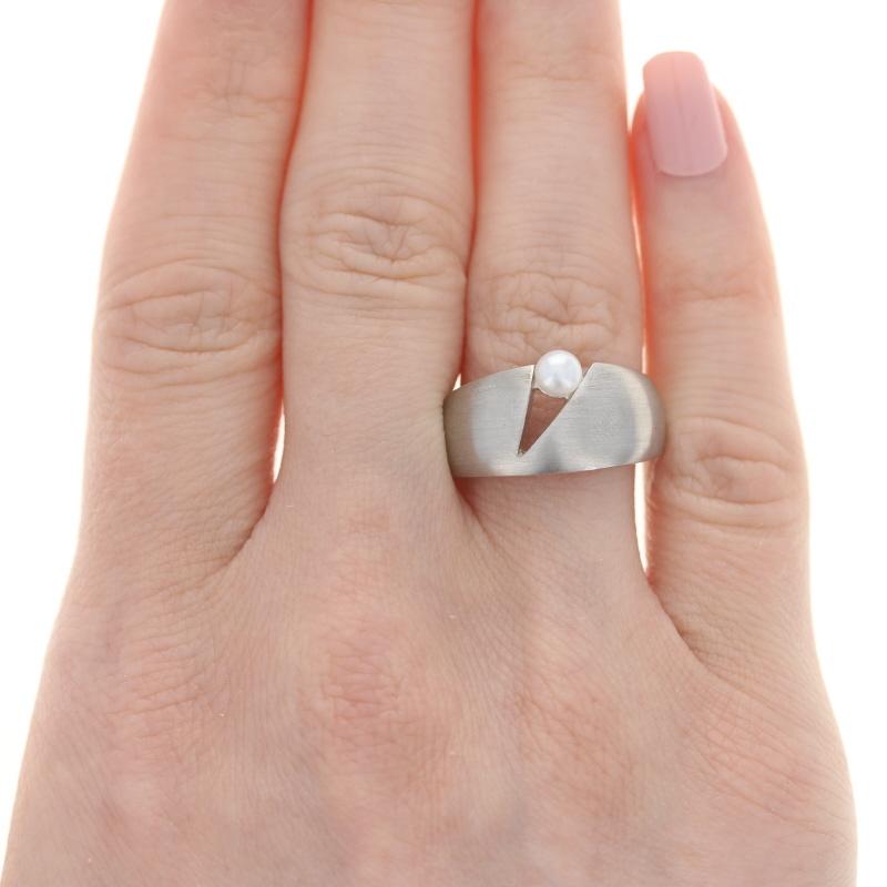 This ring retails at $175 

This ring is a size 7 3/4. Please contact for additional sizing options.

Metal Content: Sterling Silver
Finish: Satin

Stone Information:
Freshwater Pearl -  

Face Height (north to south): 15/32