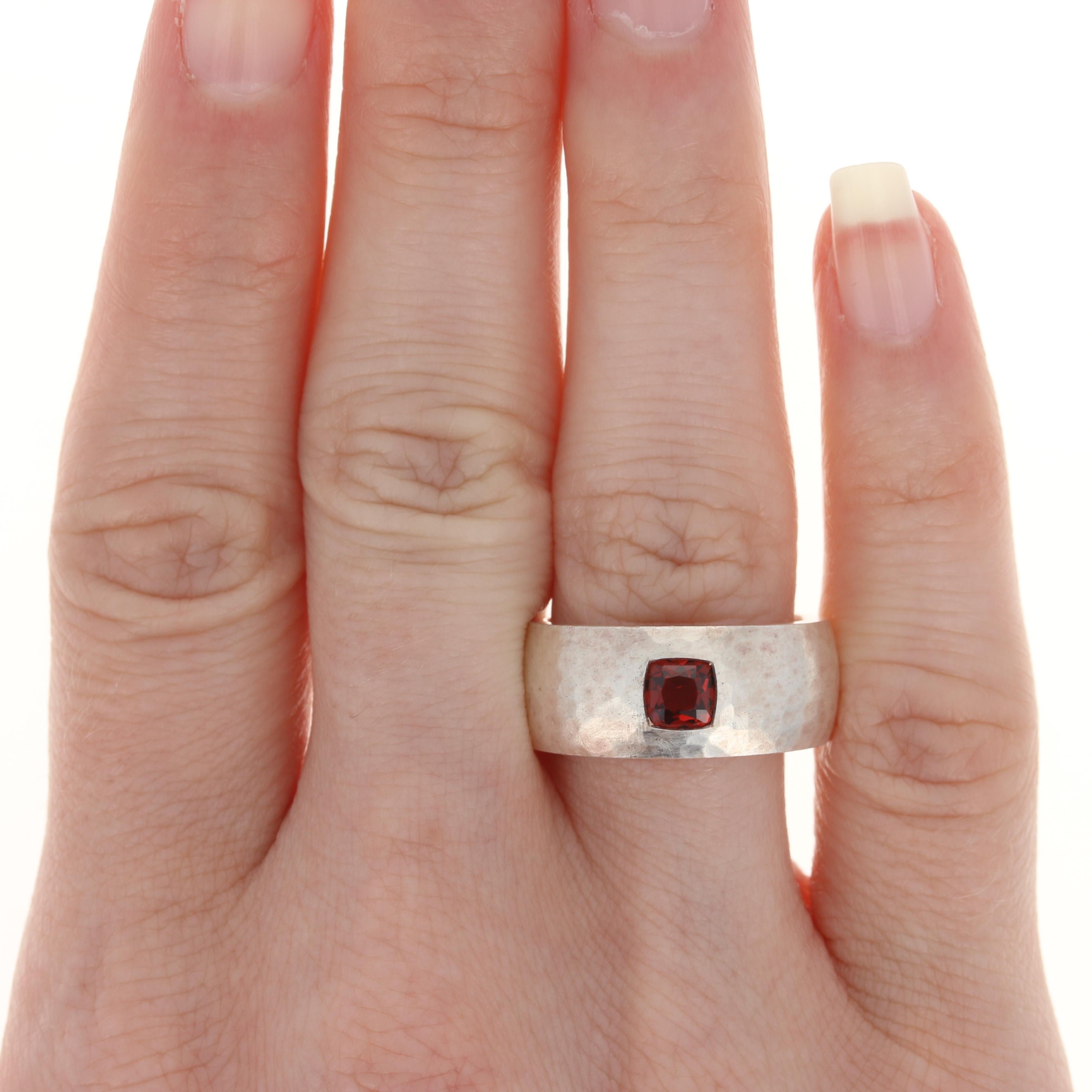 This ring retails at $350
This ring is a size 7 1/4. Please contact for additional sizing options.
Metal Content: Sterling Silver
Finish: Brush
Stone:  Garnet
Face Height (north to south): 11/32