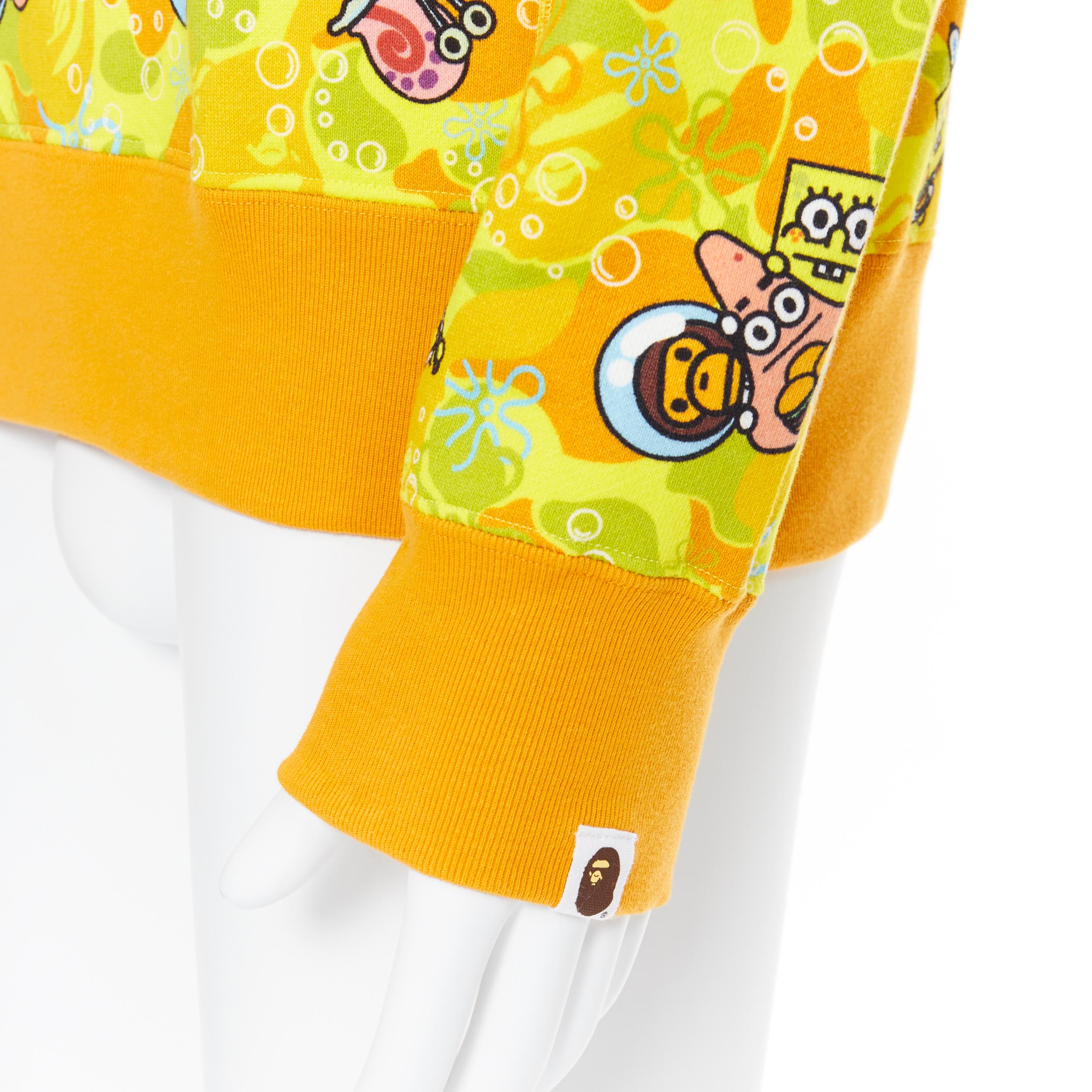 new BATHING APE BAPE SPONGEBOB SQUAREPANTS yellow camo print pullover sweater L
Brand: Bathing Ape
Collection: Spongebob Squarepants 
Model Name / Style: Sweater
Material: Cotton
Color: Yellow
Pattern: Camouflage
Extra Detail: Pullover sweater.
Made