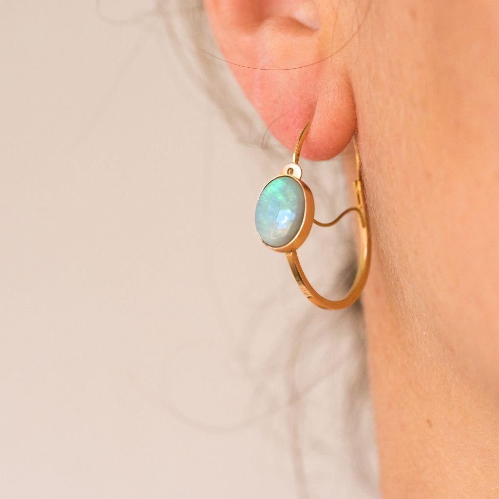 Baume's Creation - Unique piece.
For pierced ears.
Earrings in 18 carats yellow gold.
Inspired by the 19th century earrings, each earring is set with a cabochon opal on the front. The clasp sneaks from the back.
Total weight of the opals: