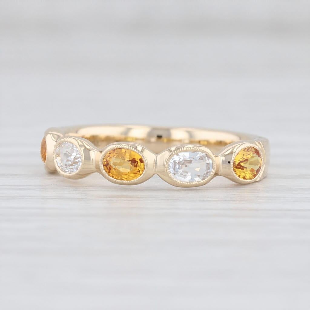 Gem: Natural Sapphires (white) - 0.43 Total Carats, Oval Brilliant Cut, White Color, Heat Treatment
- Natural Sapphires (orange) - 0.67 Total Carats, Oval Brilliant, Orange Color, Heat Treatment
Metal: 14k Yellow Gold
Weight: 3.5 Grams 
Stamps: 14k