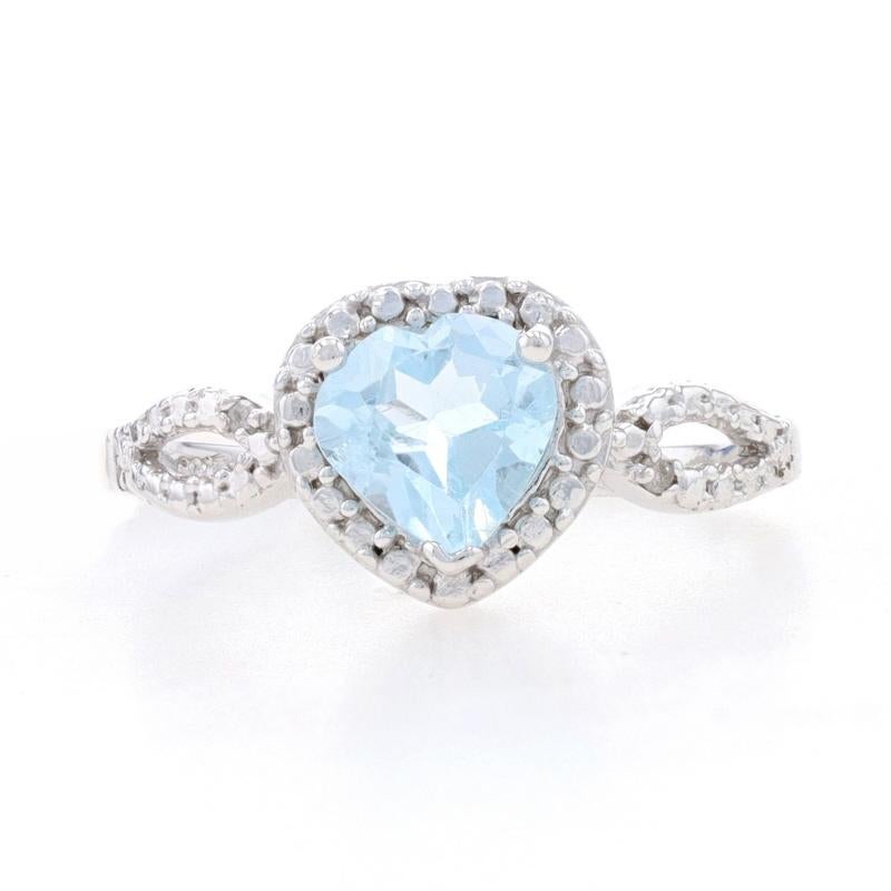 This ring is a size 6 3/4.

Metal Content: Sterling Silver

Stone Information: 
Genuine Topaz - 1.25ct, Blue, Heart, Routinely Enhanced
Genuine Diamonds - 0.01ctw, I2 - I3 clarity, J - K color

Face Height (north to south): 3/8