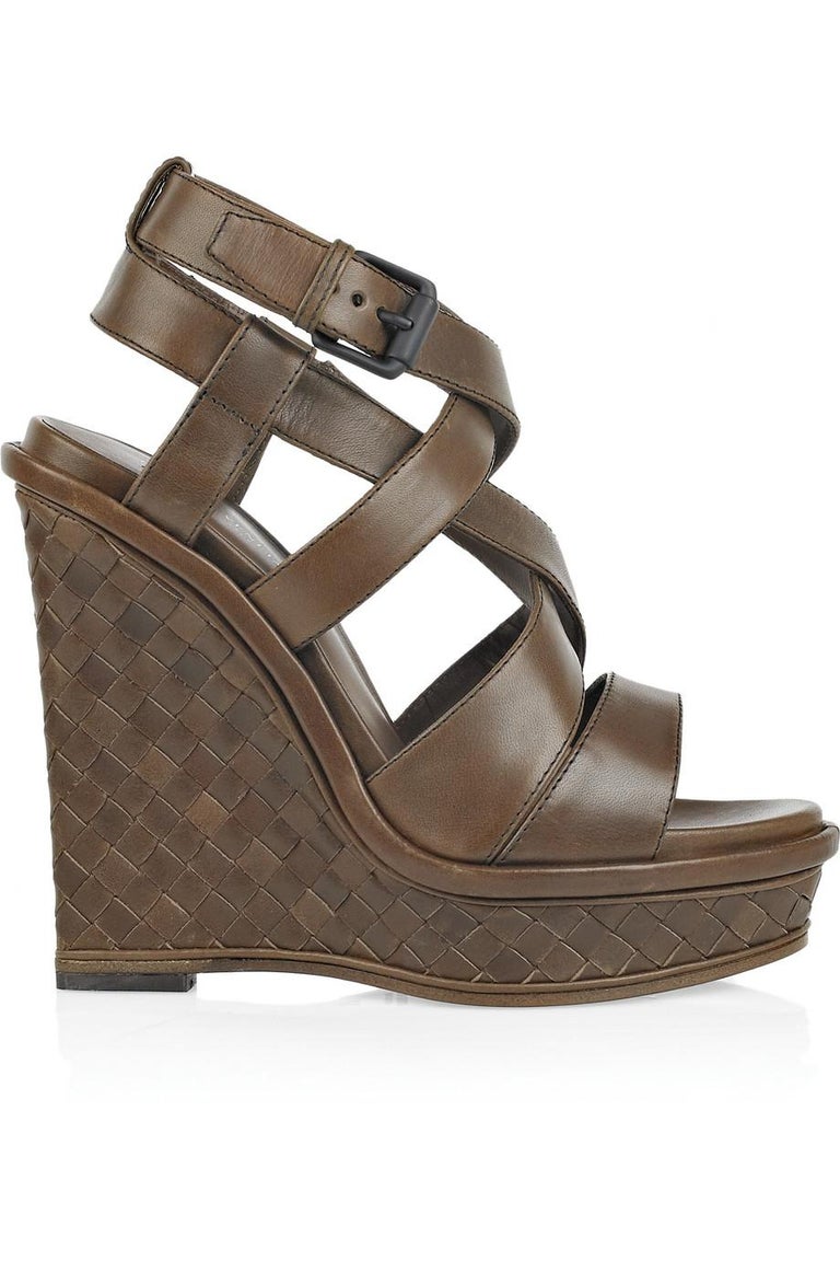 With chunky crossover straps and a signature intrecciato wedge platform, Bottega Veneta's dark-brown leather sandals are a stylish summer choice. 
Stunning Bottega Veneta Wedge Heel Sandals
Made of the finest distressed-style leather
Size EU