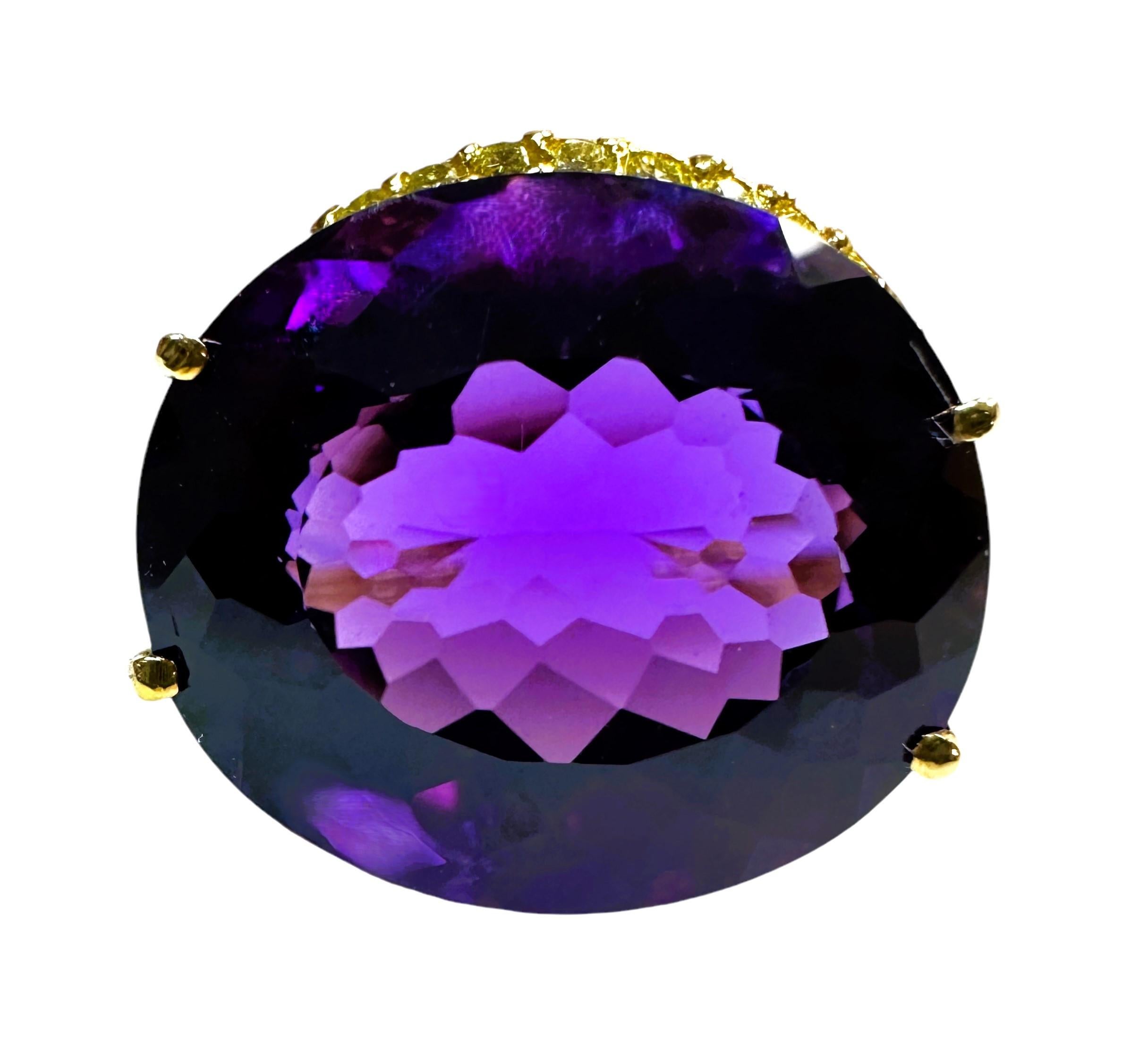 I love the color of this stone.  It is just so brilliant.  The ring is a size 6.  The stone is from Brazil and is just exquisite.  It is a fancy oval cut stone and is 13.20 Cts.   The main stone is 17.2 x 13.2 mm.  It has diamond cut violet