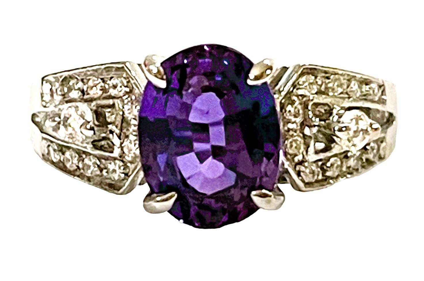 What beautiful colors in this ring!  The ring is a size 6.75  This stone is from Brazil and is just exquisite. It is an authentic natural stone. It is a highly rated stone.  It is an Oval cut stone and is 1.80 Cts   The main stone is 8.8 x 6.8 mm