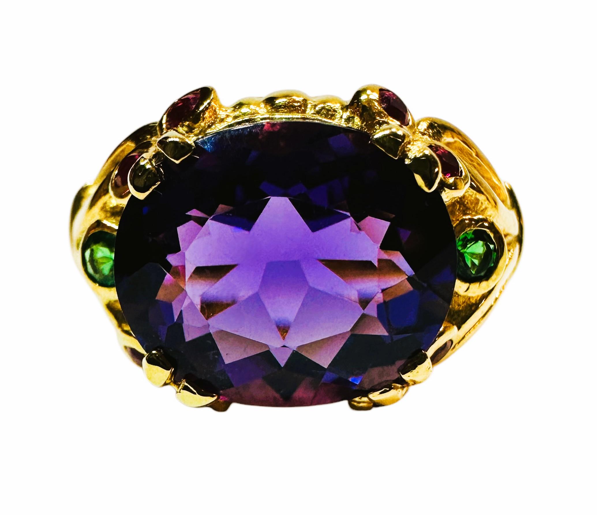 I just love the beautiful colors in these stones.  The ring is a size 6 and just stunning.  The main stone is an oval cut stone and is 5.02 cts.  It measures 12 x 10 mm and has a diamond cut green tsavorite stone on each side and is also surrounded