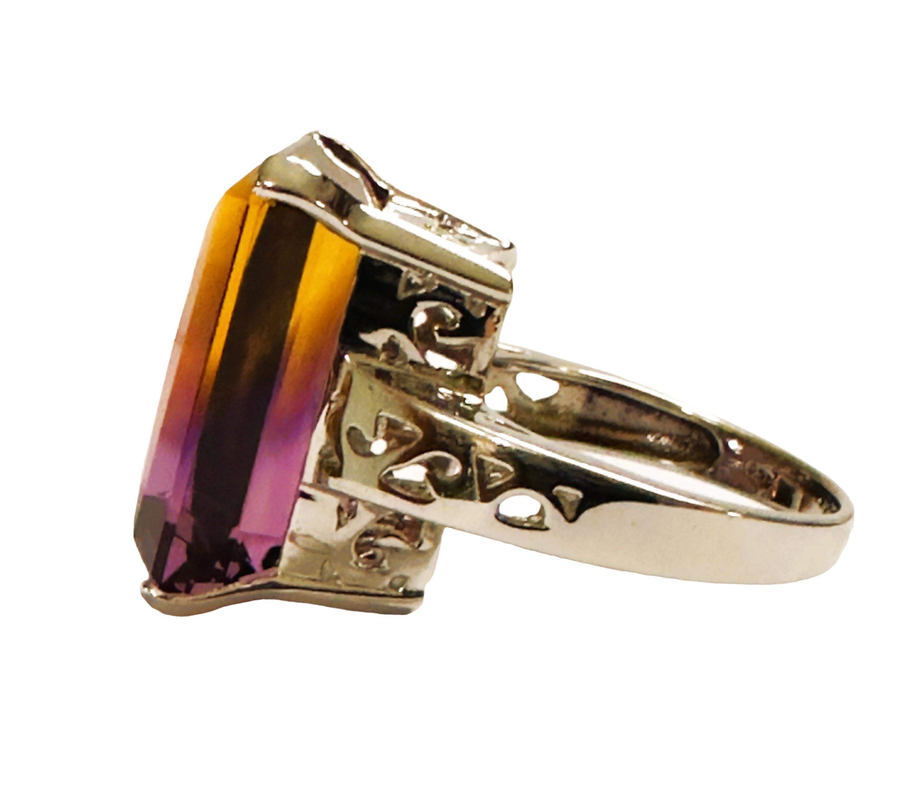 What a gorgeous ring!  It's so cool how you can see the division of the yellow and the purple in the stone.  It is a size 6.75.   It was mined in Brazil and is just exquisite.    A very high quality and rare stone.  The 