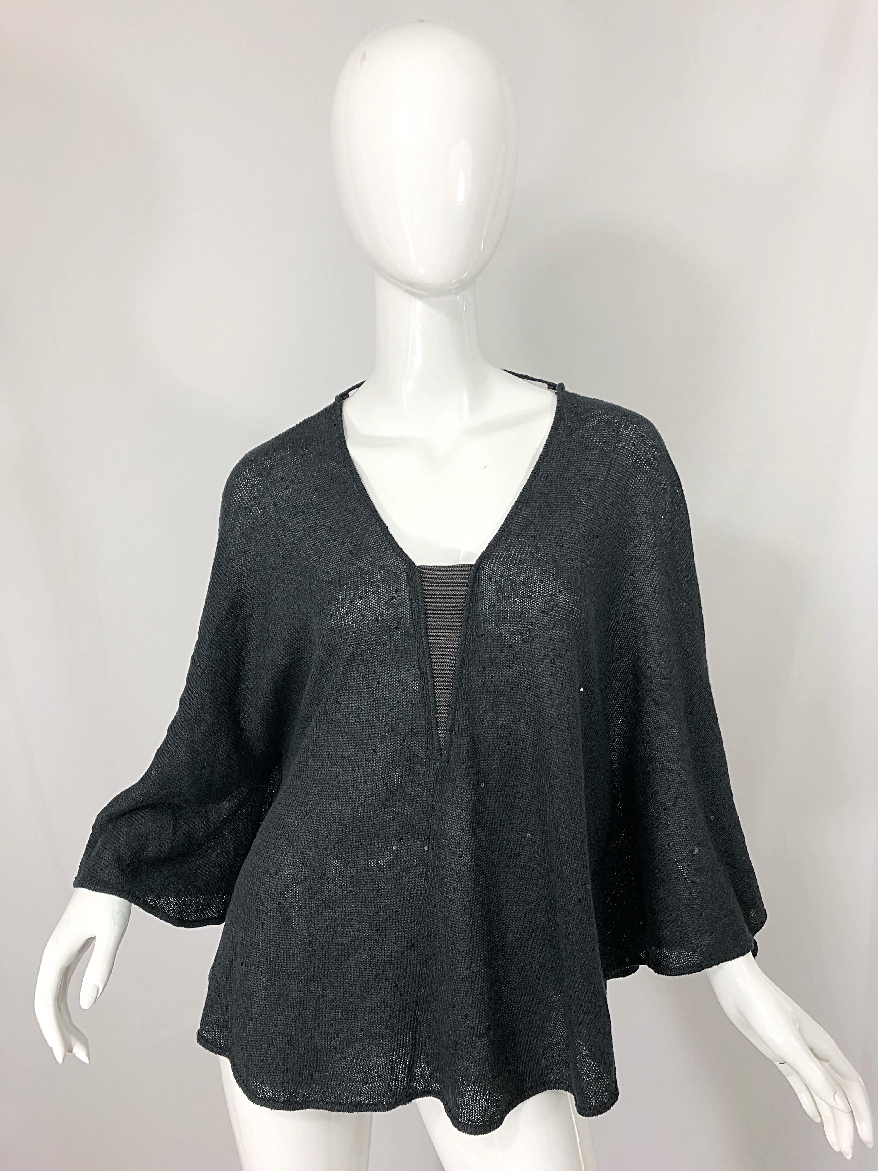 Chic brand new BRUNELLO CUCINELLI gray silk and linen blend sequined poncho top! Features hundreds of hand-sewn black mini sequins throughout. Gunmetal chain detail at center bust is lined, so you don’t feel the cold metal. String detail at back