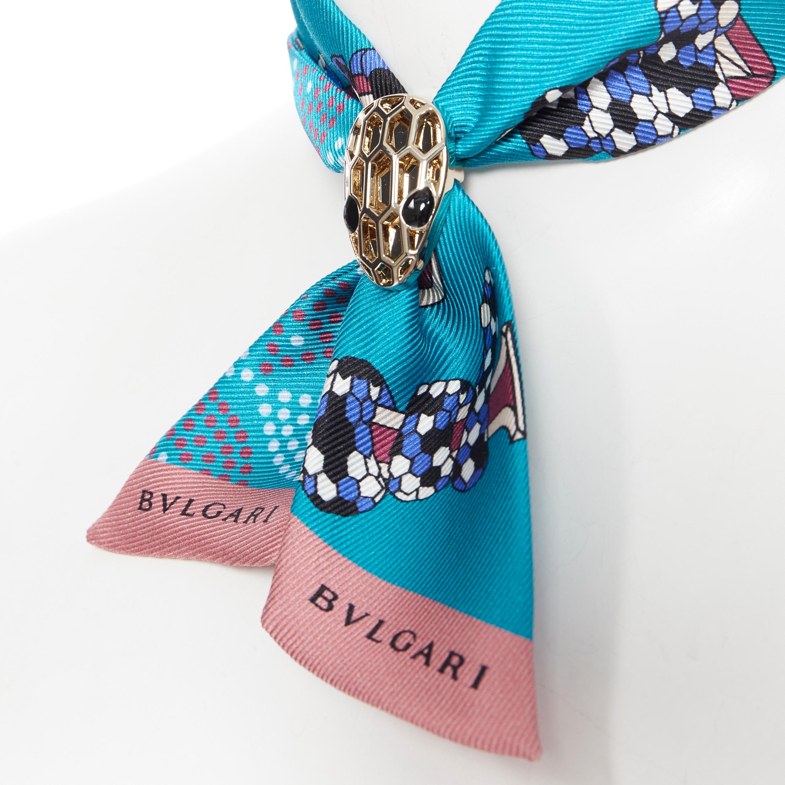 new BVLGARI Serpenti Tie Me Signature Shelleys blue silk neck scarf twilly bag 
Brand: Bvlgari
Collection: Serpenti Forever
Model Name / Style: Silk twilly
Material: Silk
Color: Blue
Pattern: Abstract
Closure: Clasp
Extra Detail: Silk print twilly.