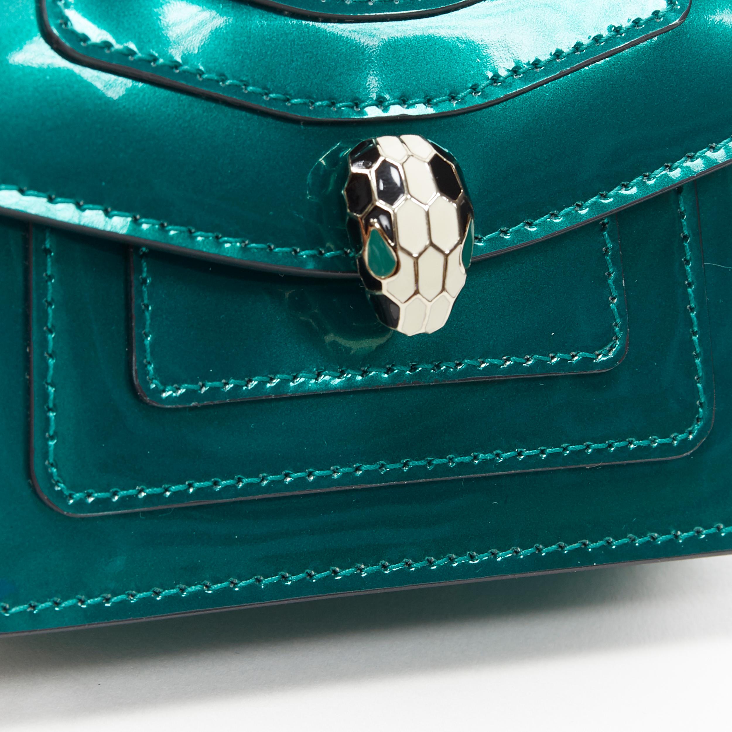 new BVLGARI Serpentine Forever emerald green patent snake flap mico bag charm 
Reference: MAWG/A00048 
Brand: Bulgari 
Model: Micro bag charm 
Collection: Serpenti Forever 
Material: Leather 
Color: Green 
Pattern: Solid 
Closure: Button 
Extra
