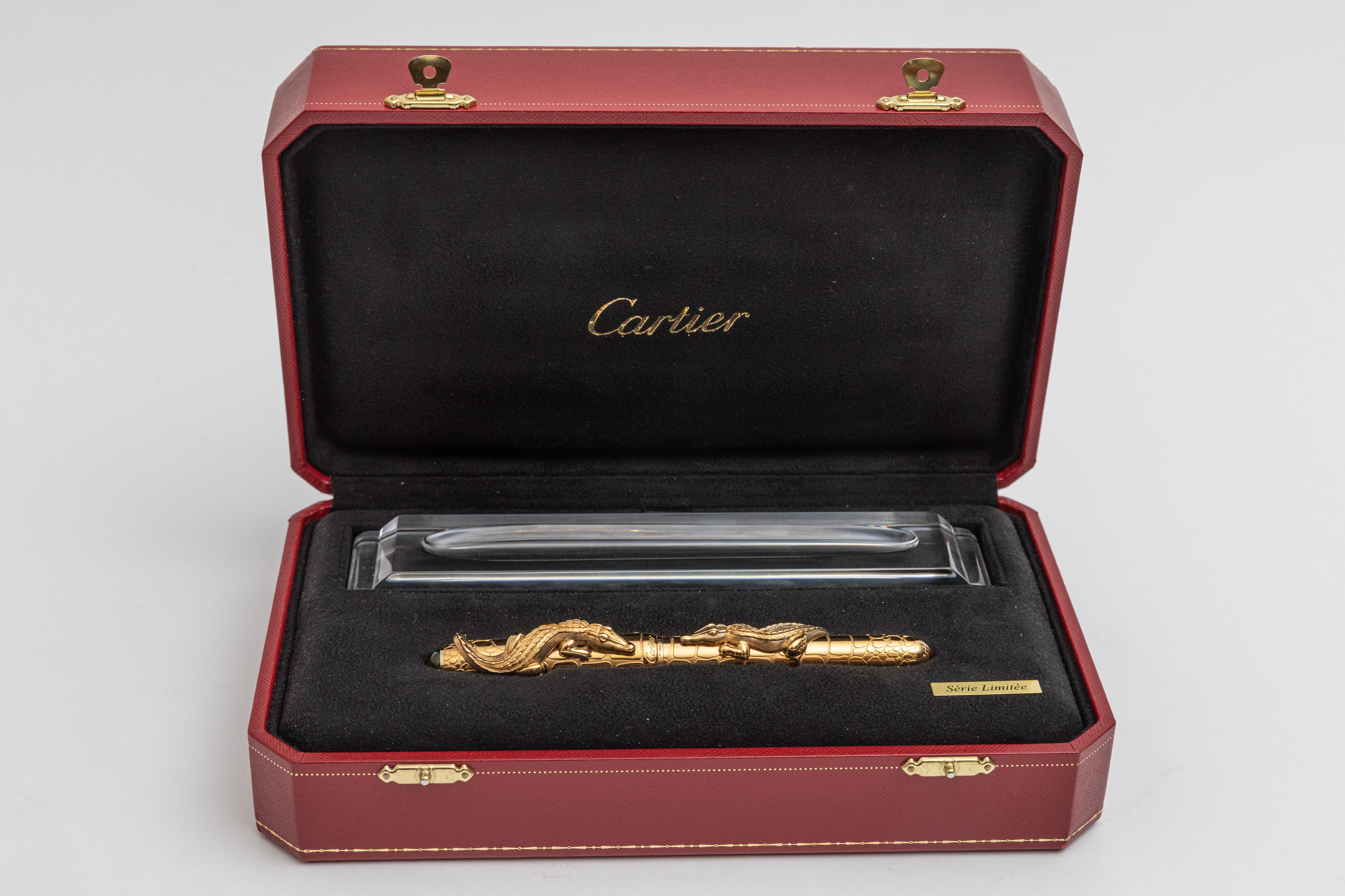 New in box and in mint condition. Originally priced $15,000 Limited Edition ( 1 of 888 worldwide) Cartier Crocodile De Cartier Exceptional Gold Fountain Pen.

Cartier's Limited edition pen represents on of the best pens ever produced.  Engraved gold
