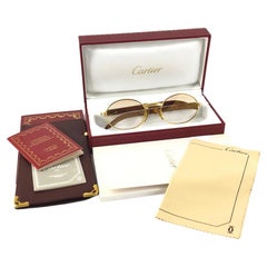 Cartier, grandes lunettes de soleil Giverny en verre brun dégradé à monture en bois et or, 51/20, neuves
