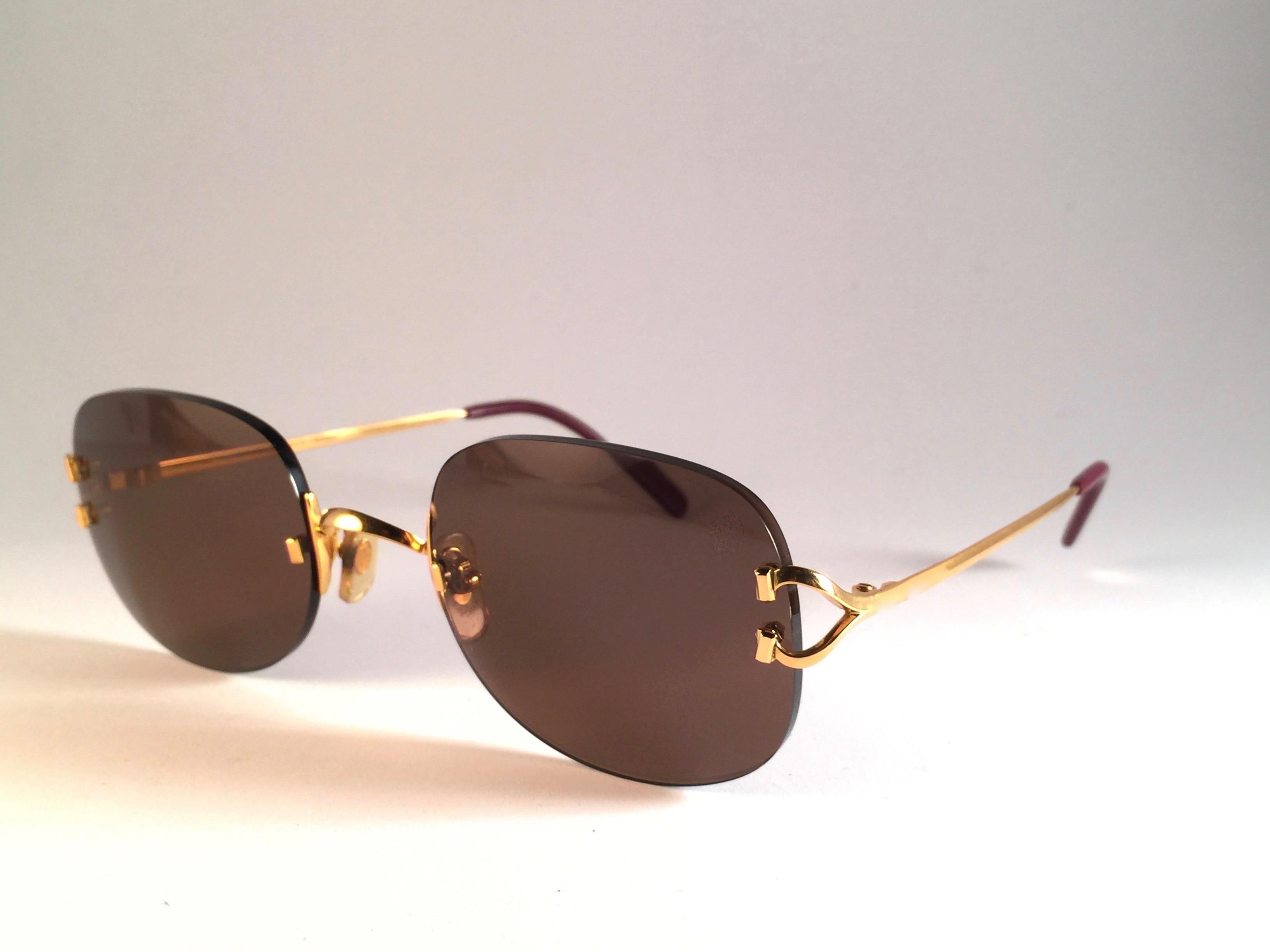 New Cartier Serrano Rimless Gold 55mm Brown Lens France Sunglasses In New Condition For Sale In Baleares, Baleares