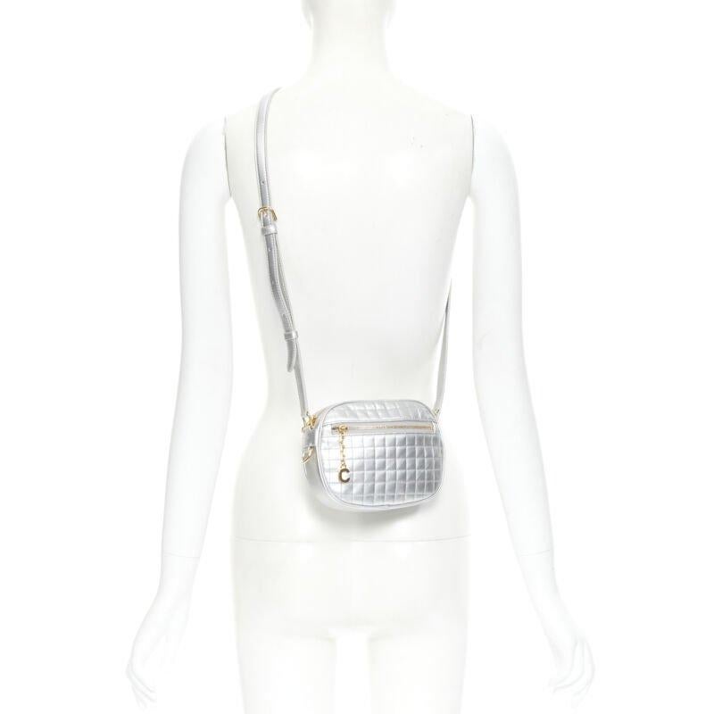 new CELINE Hedi Slimane 2019 C Charm silver quilted small crossbody camera bag
Reference: TGAS/B01428
Brand: Celine
Designer: Hedi Slimane
Model: Small C Charm camera bag
Collection: 2019
Material: Leather
Color: Silver
Closure: Zip
Extra Details: C