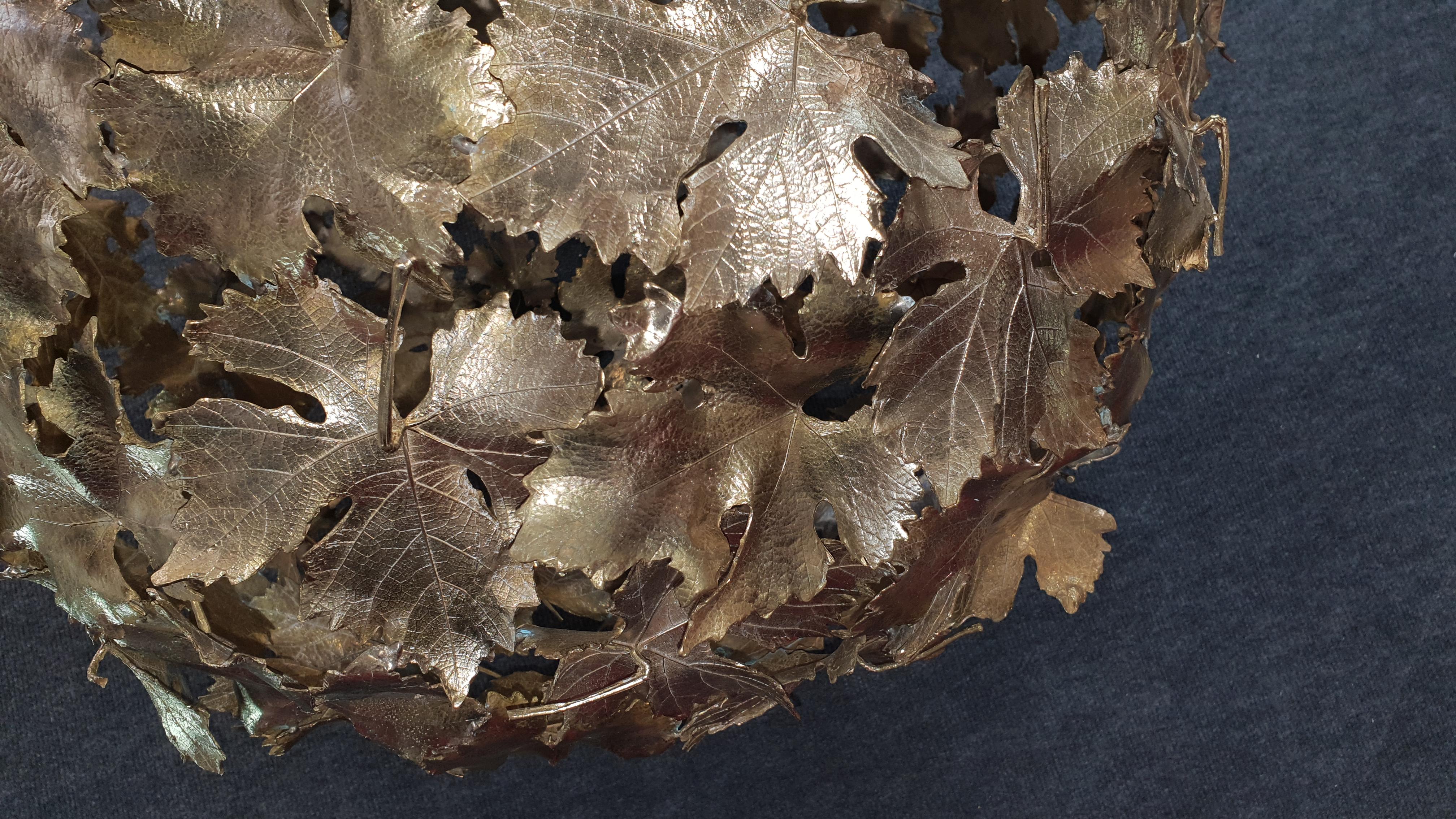 Magnificent chandelier in solid casted brass. Extraordinary elaborate finishes. Rich hangings with handmade leaves. Surface either brass and patinated.
  