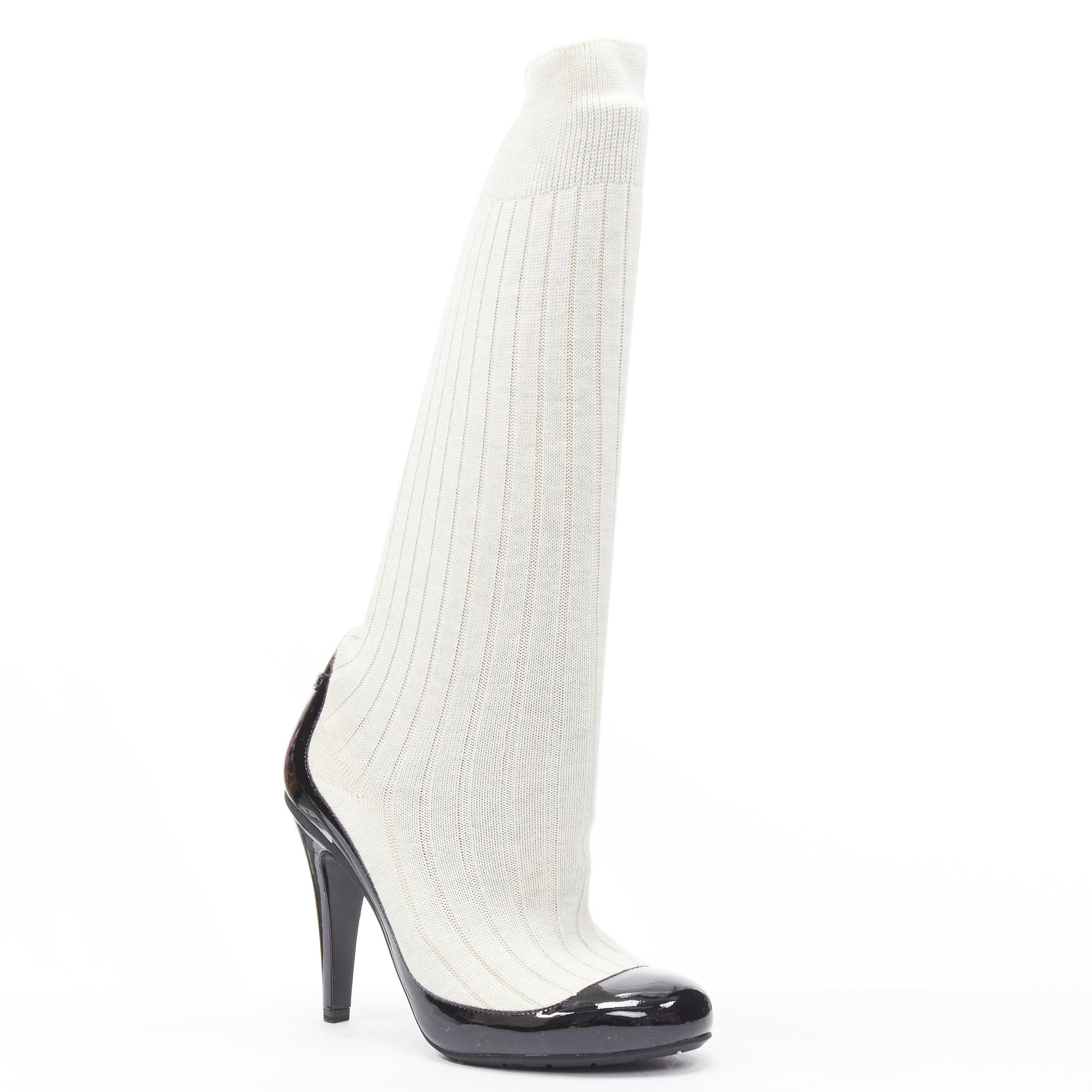 new CHANEL 2014 Runway beige ribbed sock black patent CC logo high heel EU37.5 Reference: MELK/A00223
 Brand: Chanel 
Designer: Karl Lagerfeld 
Collection: 2014 Runway 
Material: Patent Leather 
Color: Beige 
Pattern: Solid 
Extra Detail: Ribbed
