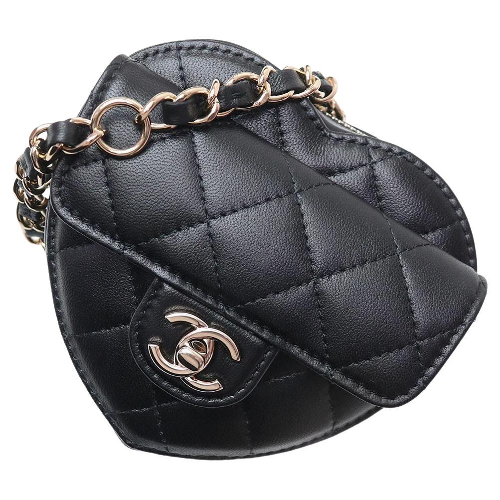 Chanel 22s Black Quilted Lambskin CC in Love Heart Bag.
Made In: France
Leather Exterior Color - Black 
Fabric Interior Color - Red 
Hardware Color - Gold and Black Tone
Measurements: 
5.25” x 4.5” x 1.75” drop: 22”
Height: 5.25 in (13.34 cm)
Width: