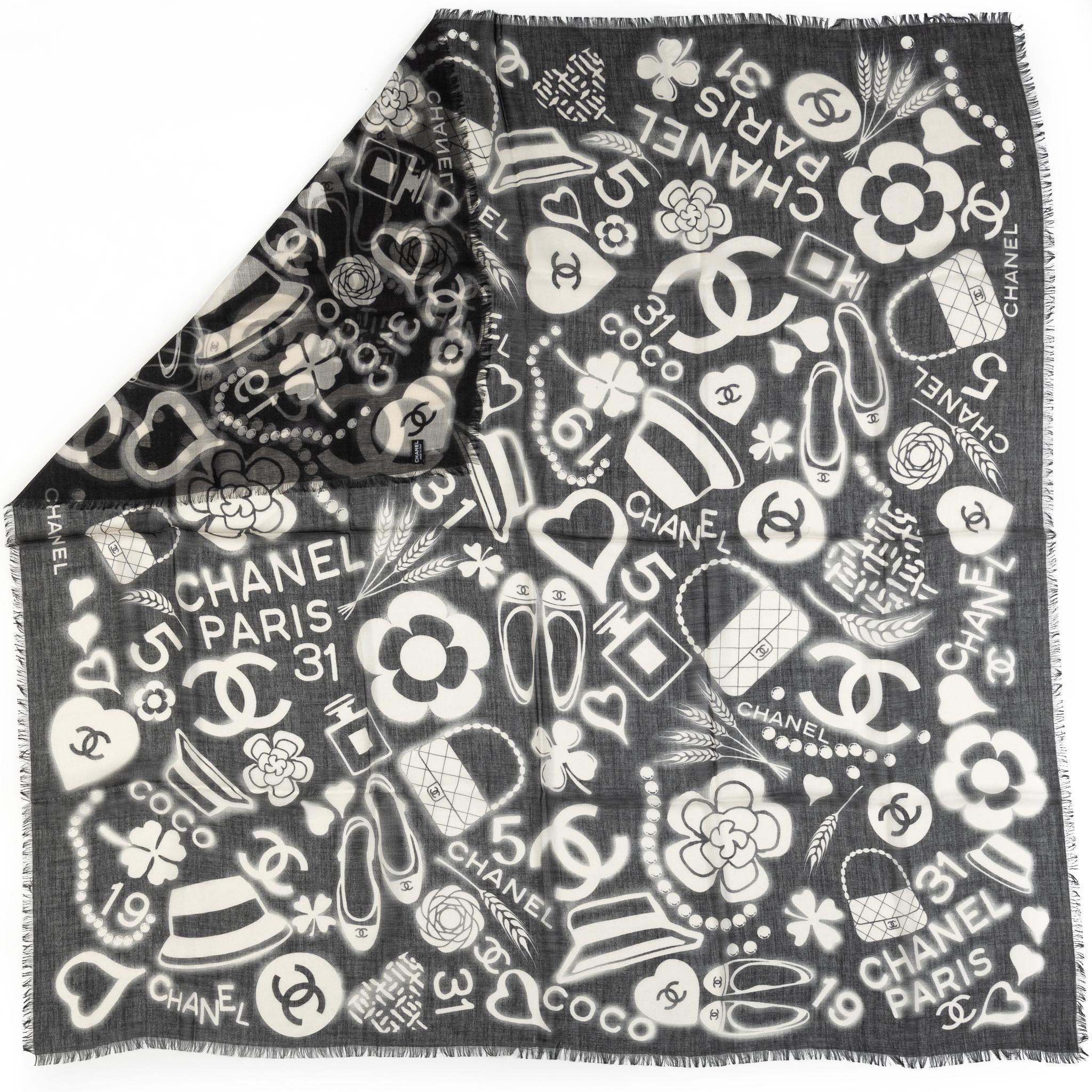 Chanel brand new 65% cashmere 35% silk black and white iconic symbols square oversize shawl. Comes with original tag.
