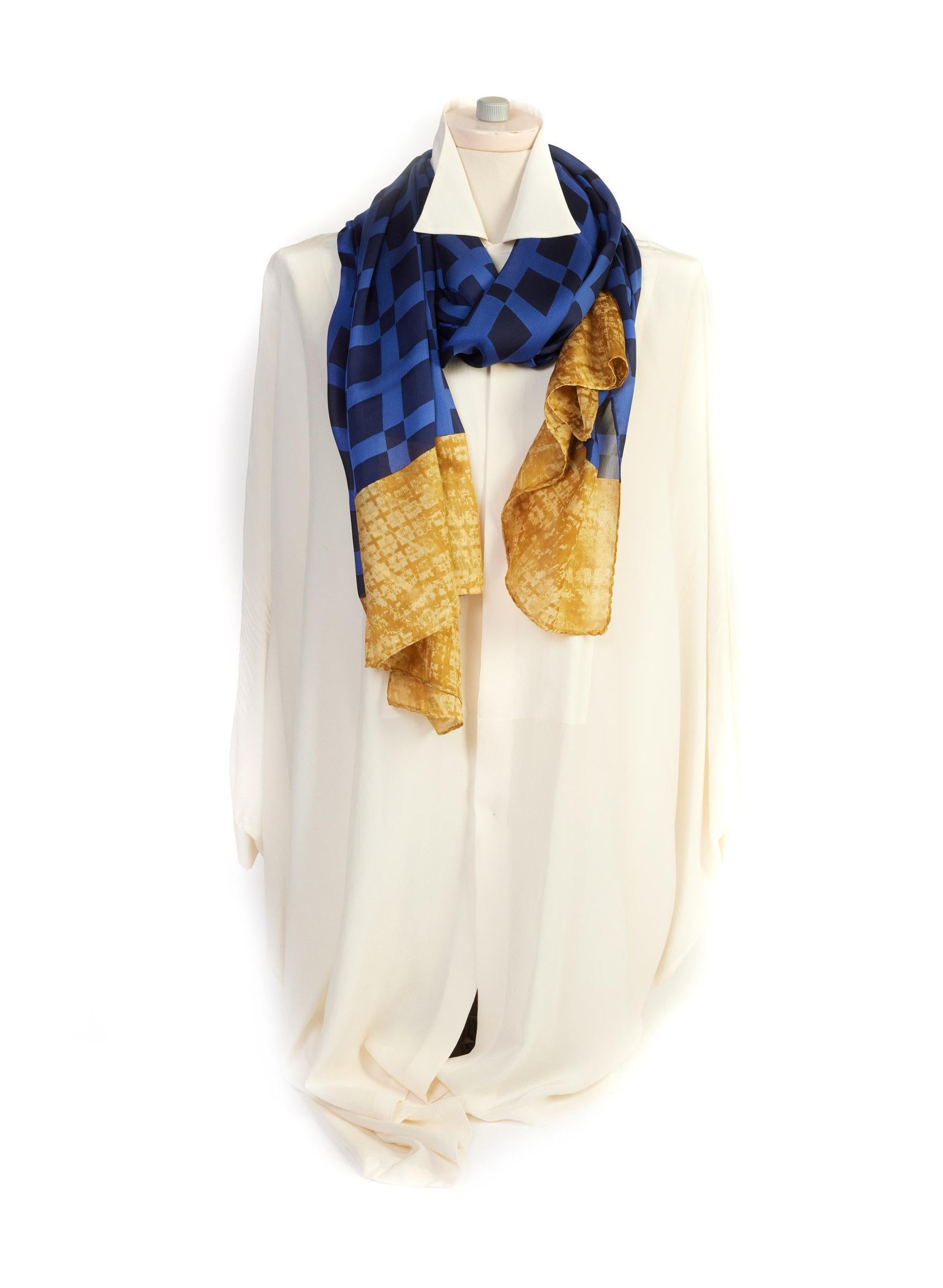 Chanel long stole with blue and gold design. Hand rolled edges.