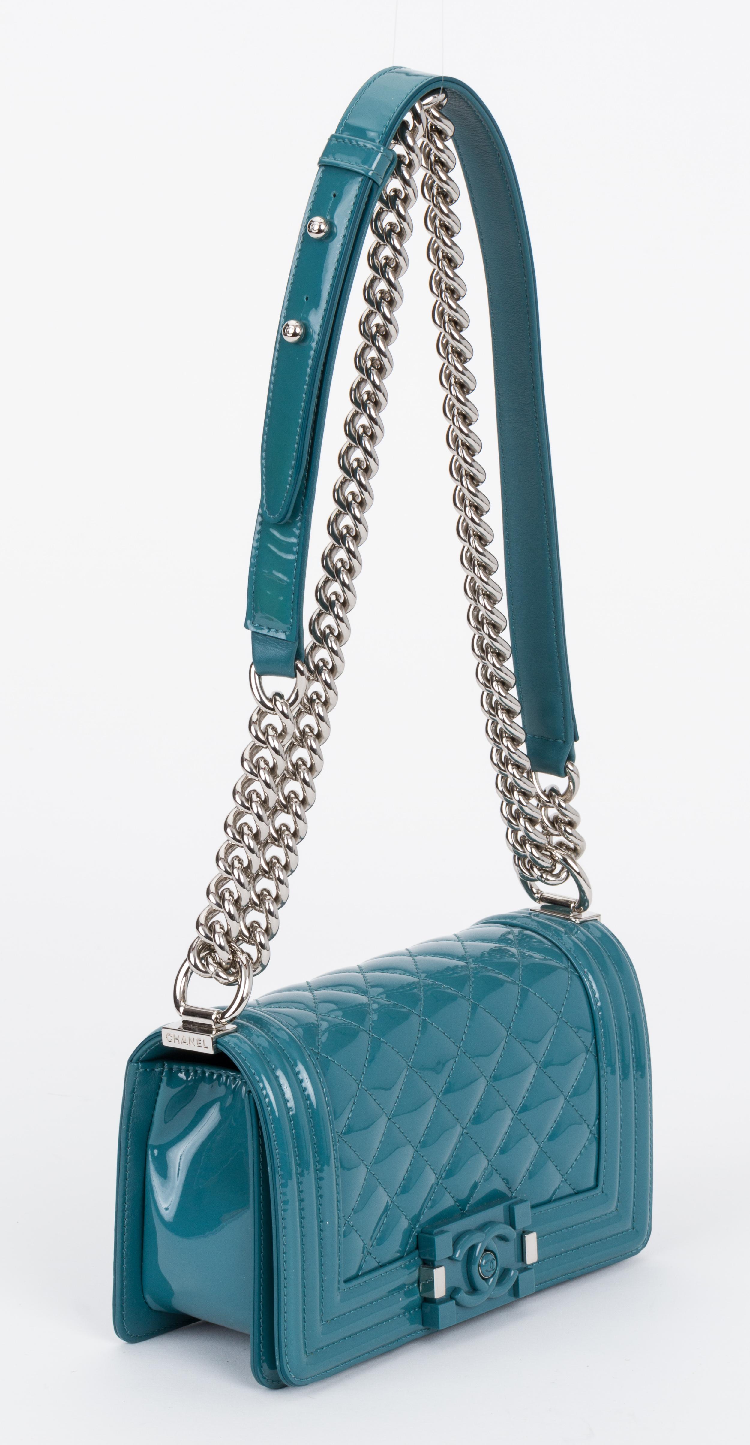 Chanel new condition small boy bag in cerulean blue patent leather and silver tone hardware. Handle drop 12