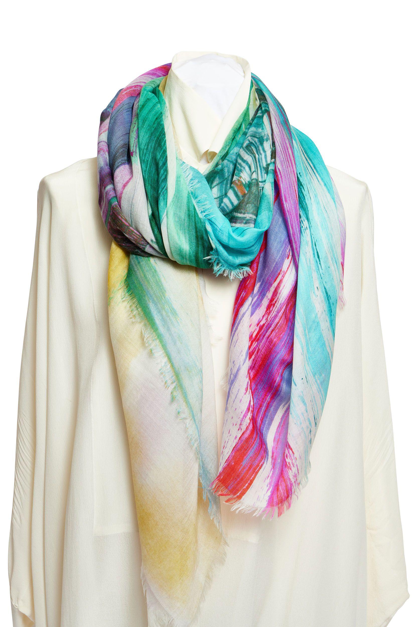 New Chanel watercolor scarf with a fringed trim. Coco cuba collection . The scarf shows a bridge pattern in different colors like pink green and blue. In one corner is a green CC logo. It is 100% cashmere and you can wear it as a scarf or just over