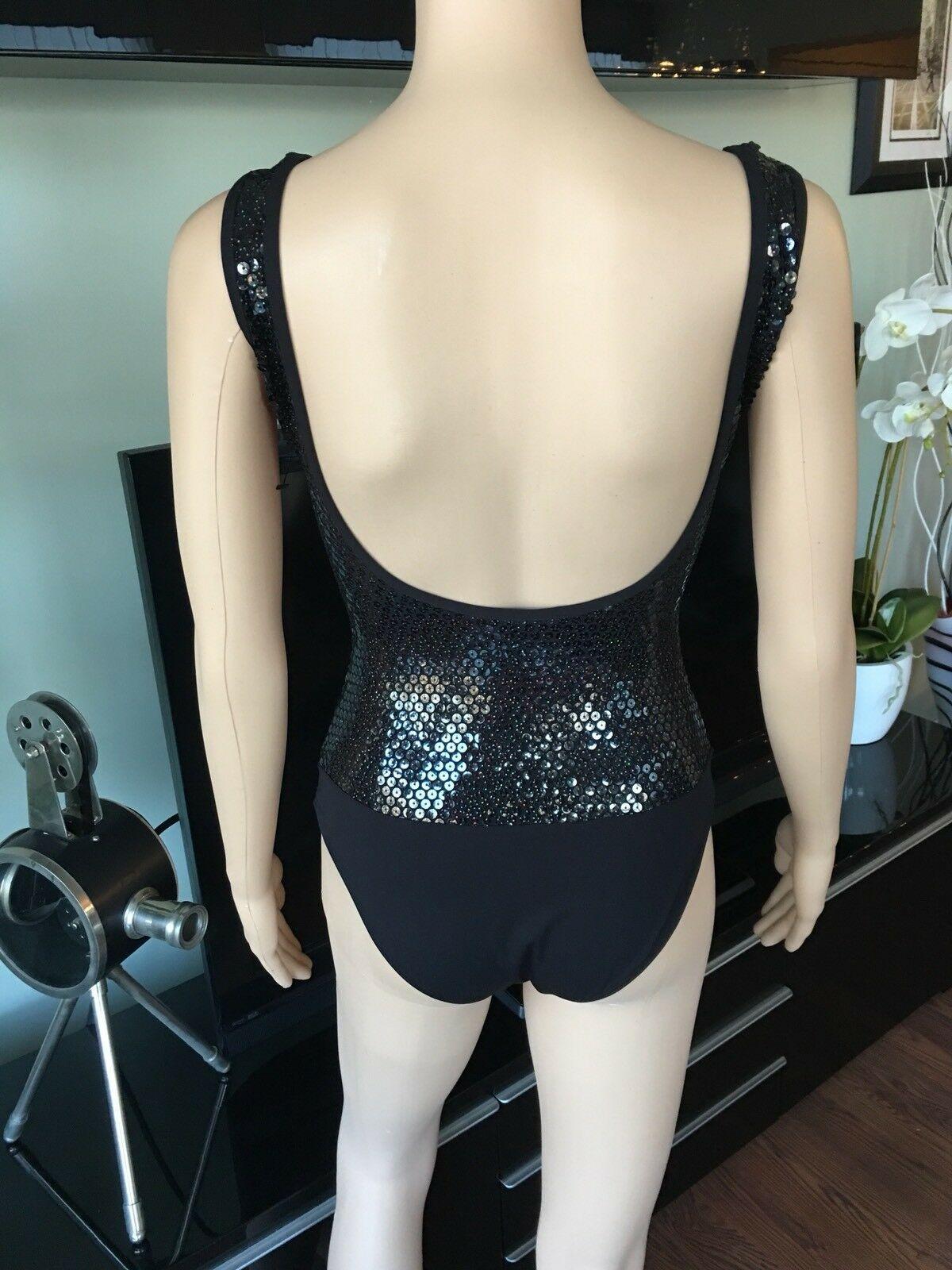 NEW CHANEL RUNWAY SEXY SEQUIN OPEN BACK SWIMSUIT BODYSUIT FR 36 US 4

From the 2016 Cruise Collection. Black Chanel one-piece swimsuit with sequin embellishment throughout and button accents at front. Includes tags.
