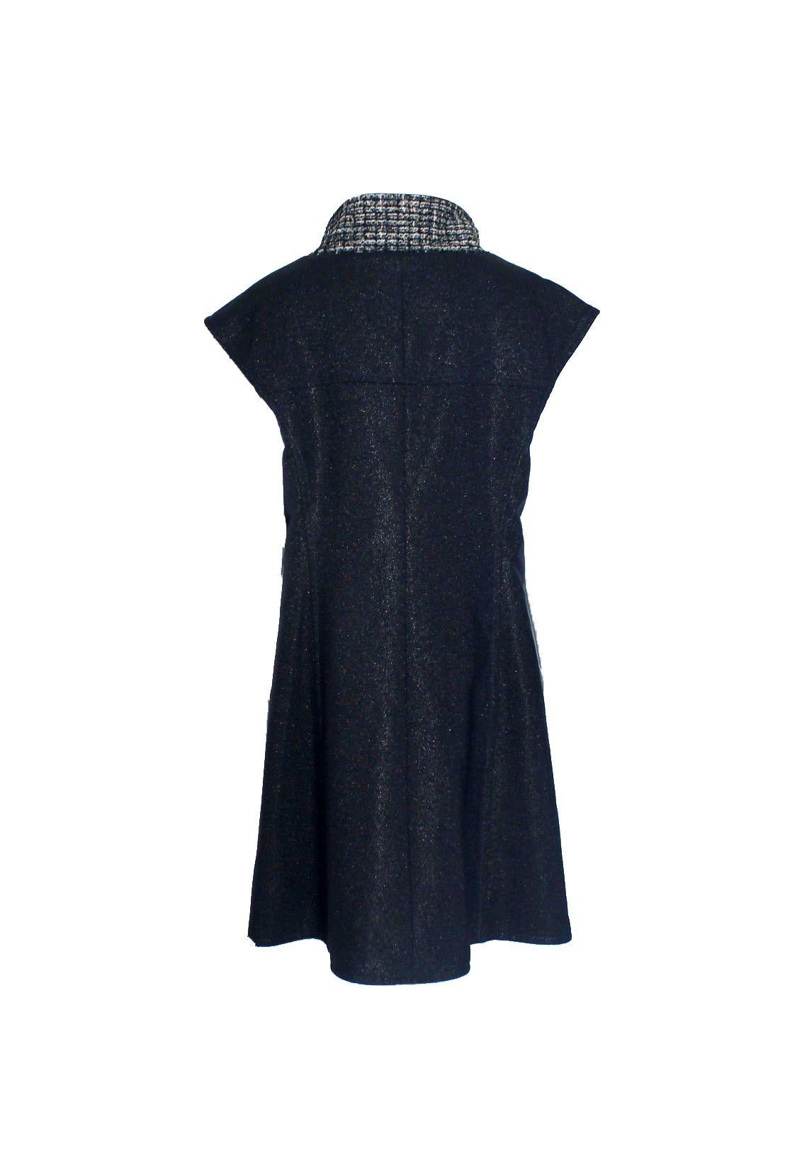 Beautiful Chanel signature piece
Fantasy tweed fabric
Two front pockets 
Such a versatile piece - can be worn as vest, jacket, dress or coat! 
Closes in front with buttons
Fully lined with beautiful tweed fabric
Chain at hem for a perfect fit
Made