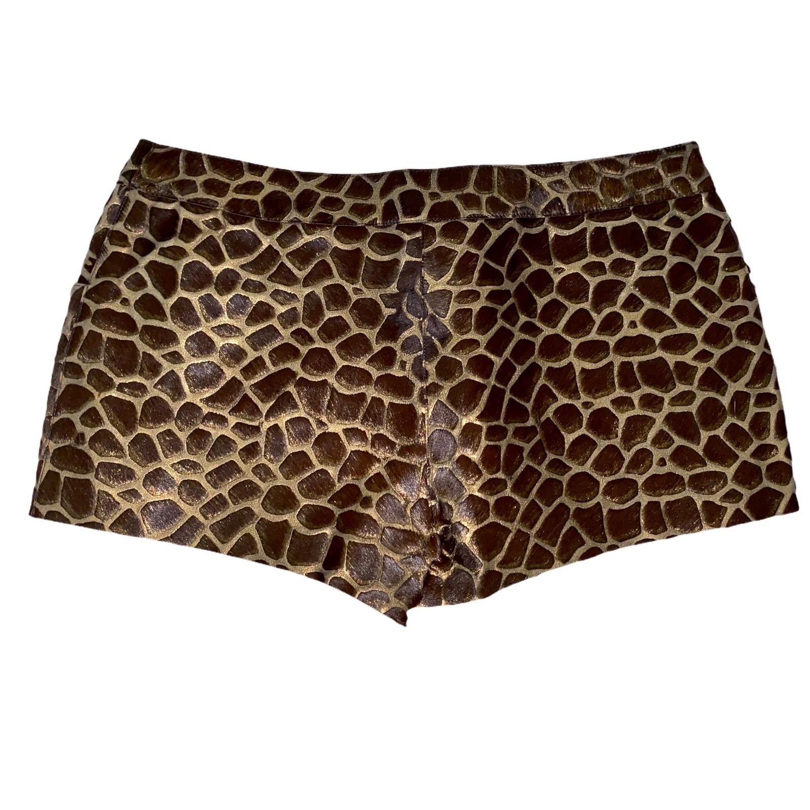  Rare piece!
Chanel leather hot pants in safari style 
    Metallic leather with fur trimming
   Gorgeous animal print
    Golden button with CC logo
Two side pockets
    Made in France
Size 40
    Dry Clean Only
Made in France