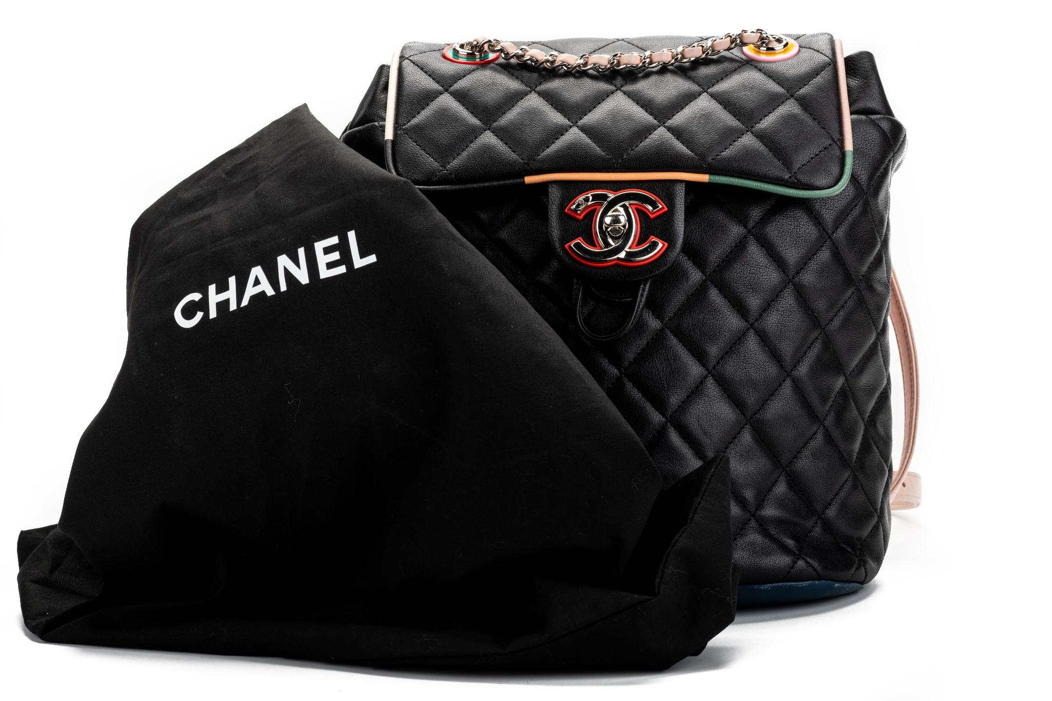 Chanel multicolor lambskin backpack with silver tone hardware. Black, navy, red and pink with colorful trim and grommets. One little mark on the pink back pocket (please refer to photo). Collection 23. Comes with hologram and original dust cover.