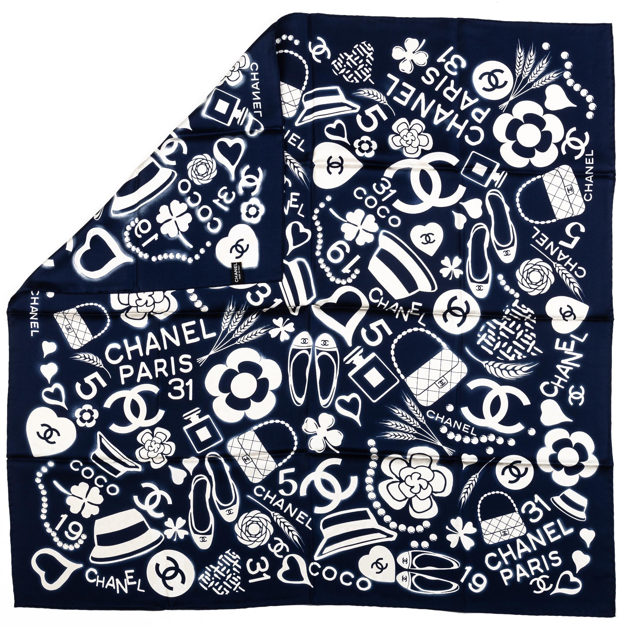 Chanel brand new iconic symbols design 100% silk scarf in navy blue and white combination . Hand rolled edges. Care tag.
