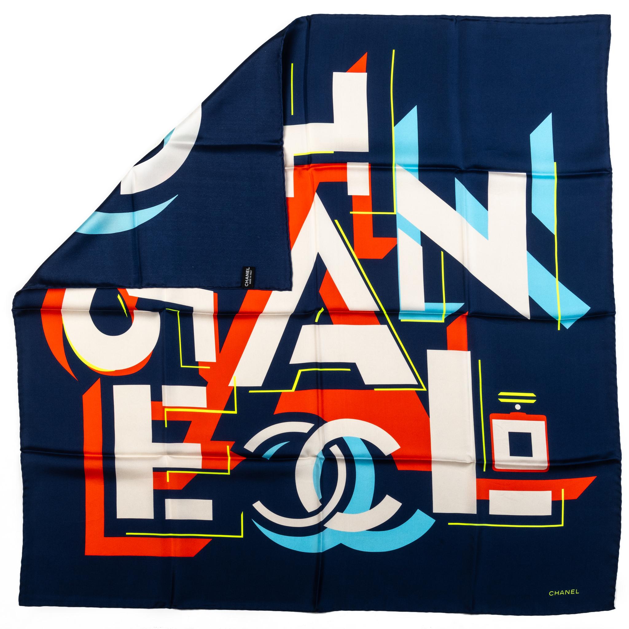 Chanel brand new scattered letters design 100% silk scarf in navy and white combination . Hand rolled edges. Care tag.
