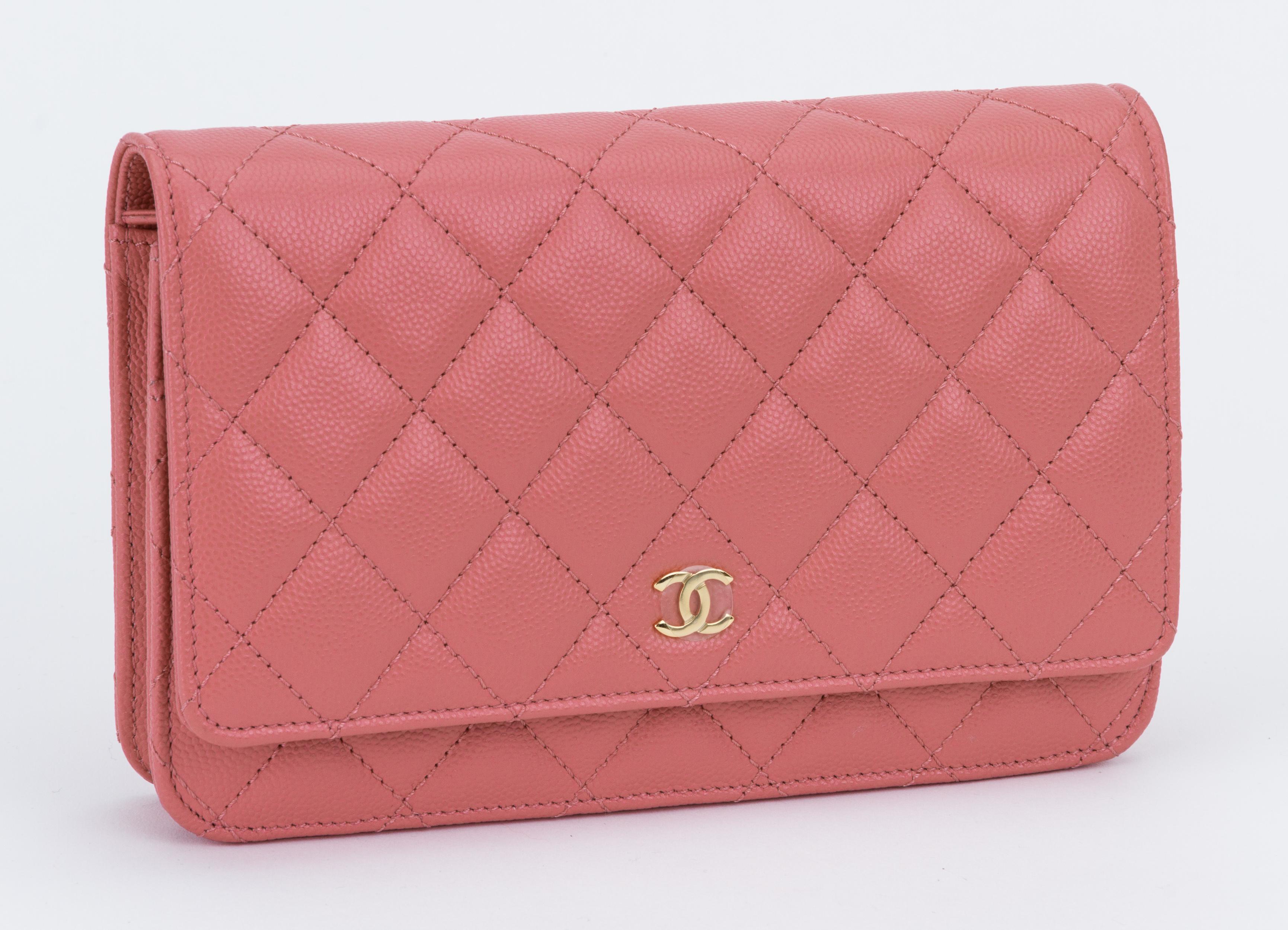 Chanel pink caviar leather cross-body wallet on a chain with gold tone hardware. Brand new , unworn condition. Comes with hologram, id card, felt and original dust cover.