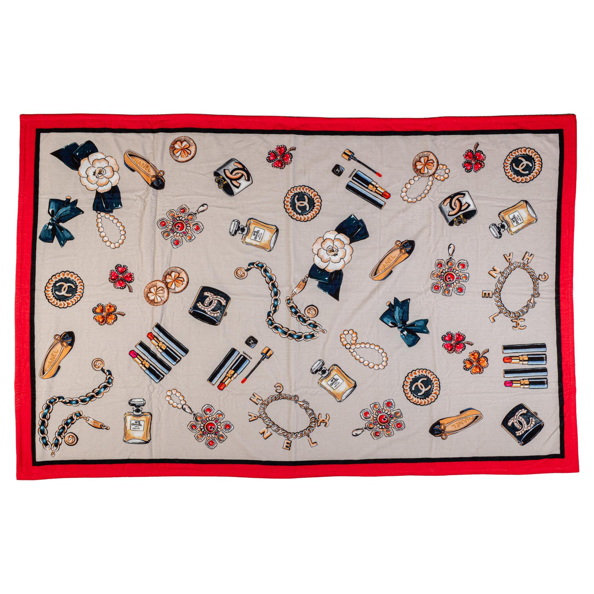 Chanel brand new beach set, tote and matching beach towel. Terry cloth red bag lined in cotton print matching the terry cloth towel. Detachable pouch can be worn separately. Towel 100% cotton, 70