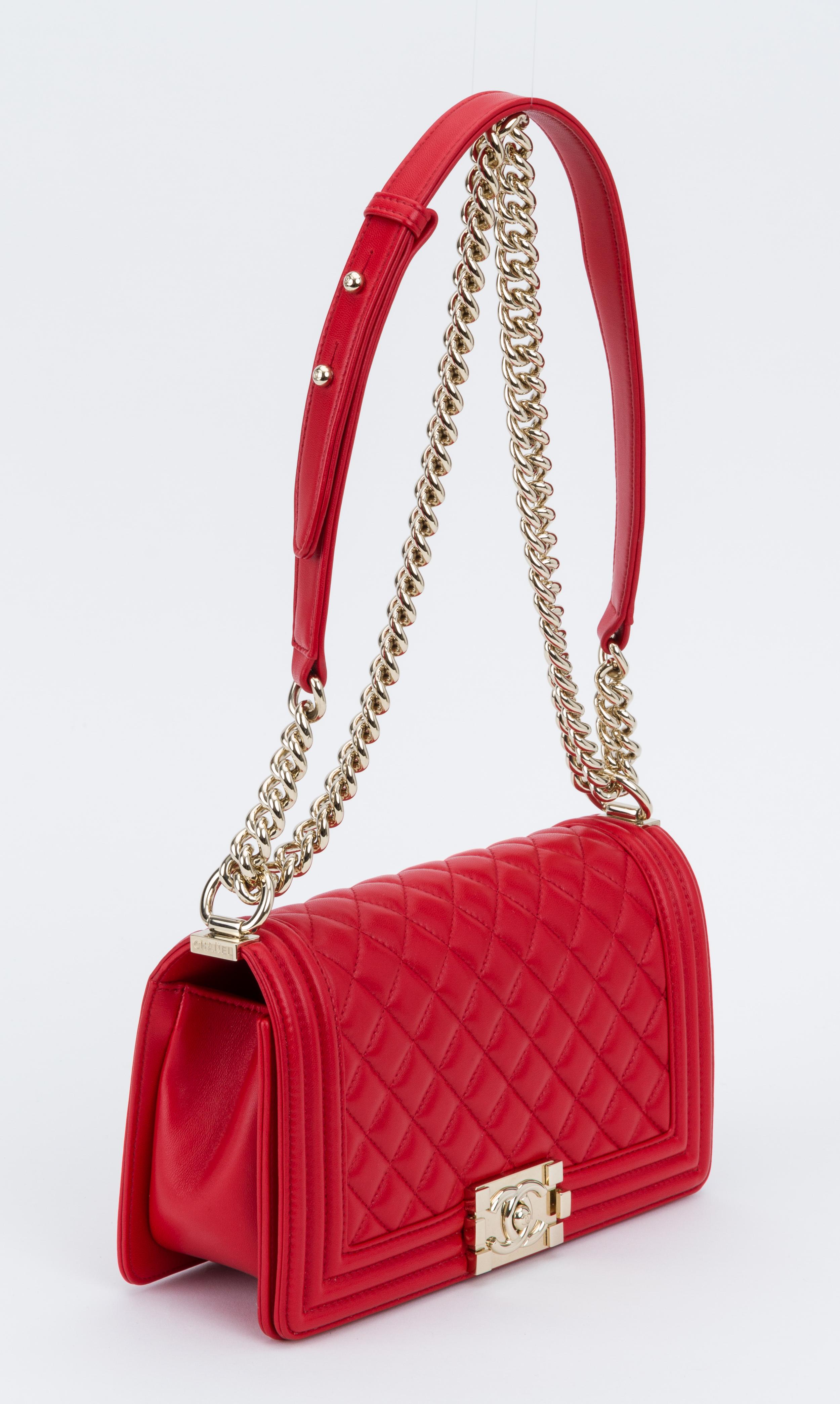 Chanel new medium boy bag in red lambskin leather with gold tone hardware. Shoulder drop, 11