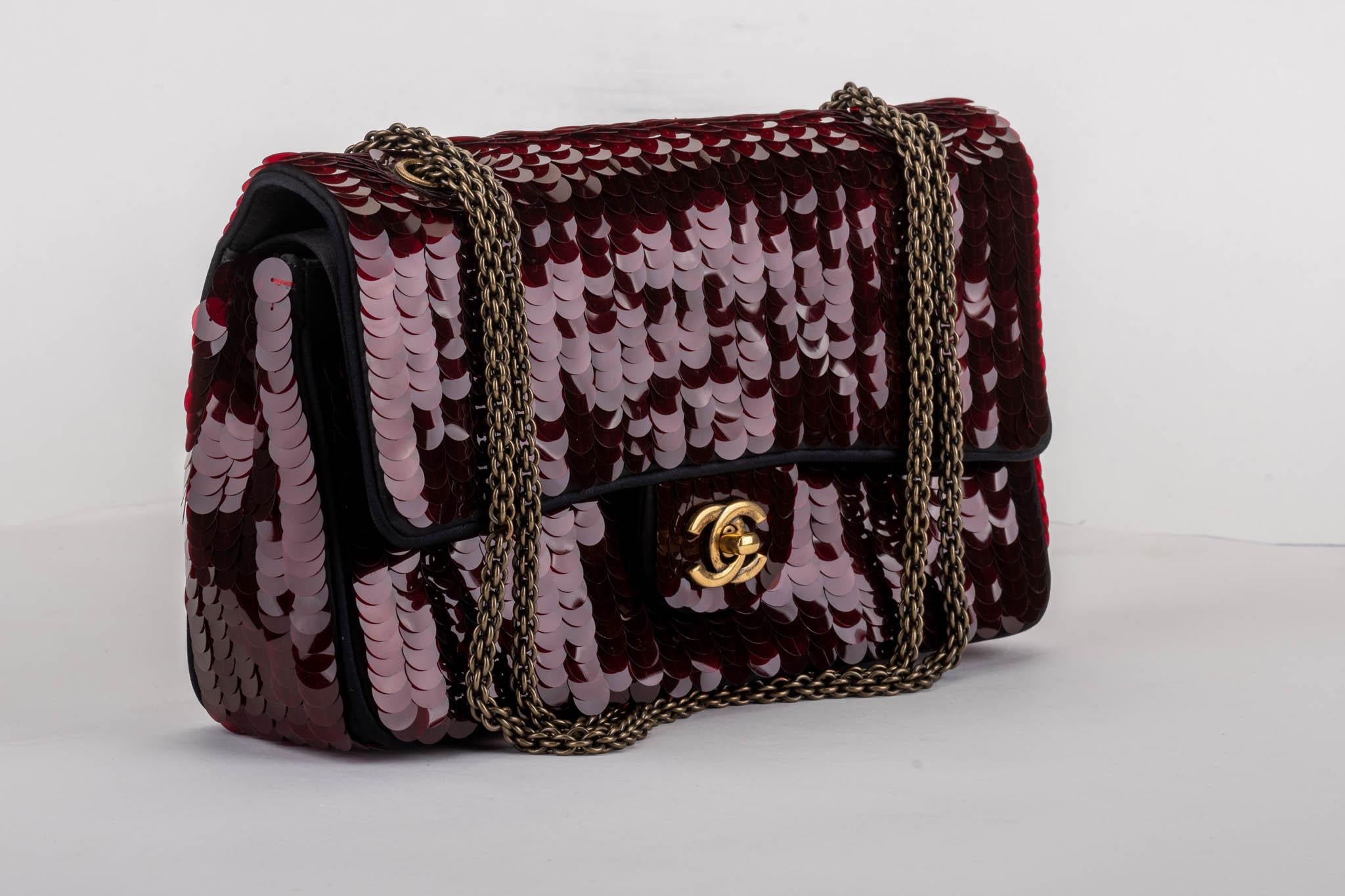 Chanel brand new limited edition Shanghai collection in burgundy sequins and black silk satin double flap. Strap drop 17.75
