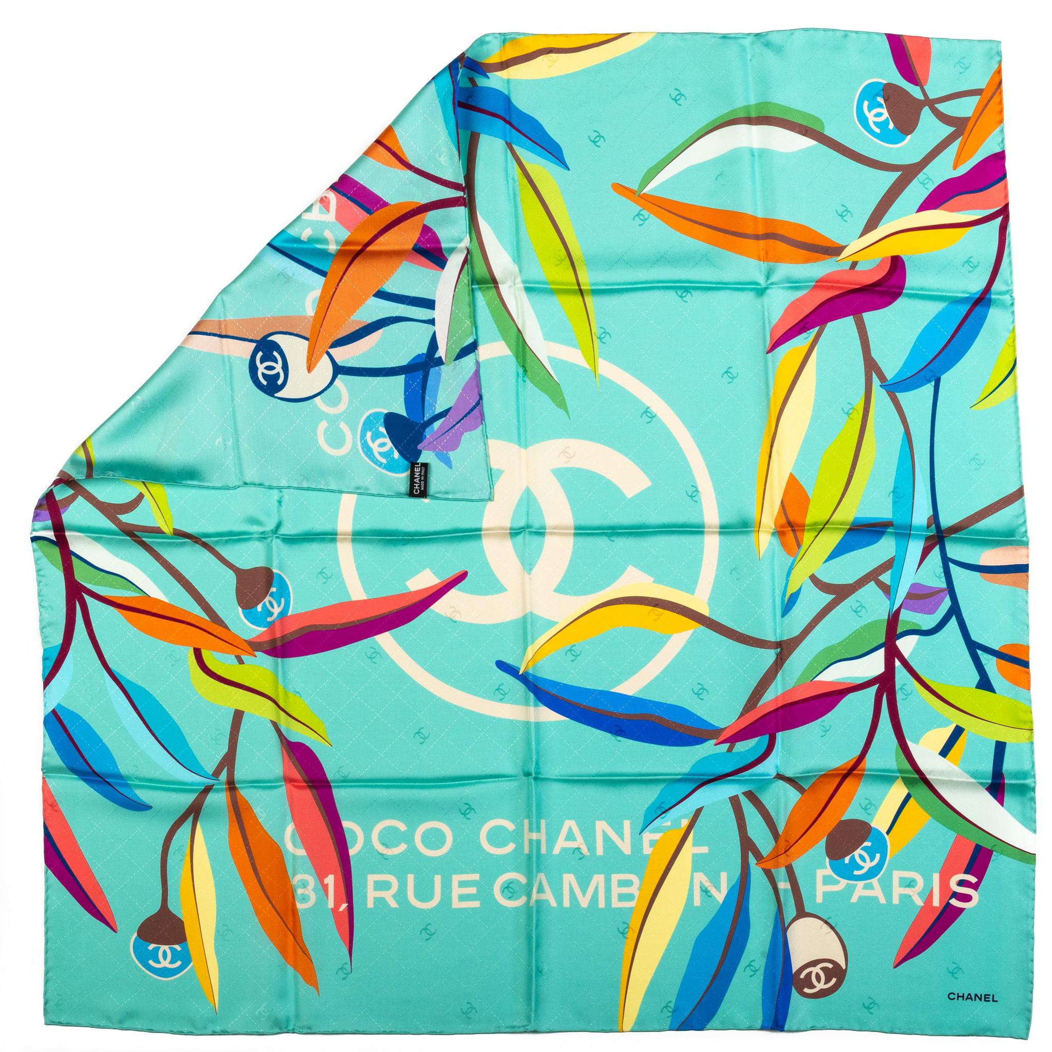 Chanel brand new leaves design 100% silk scarf in teal . Hand rolled edges. Care tag.