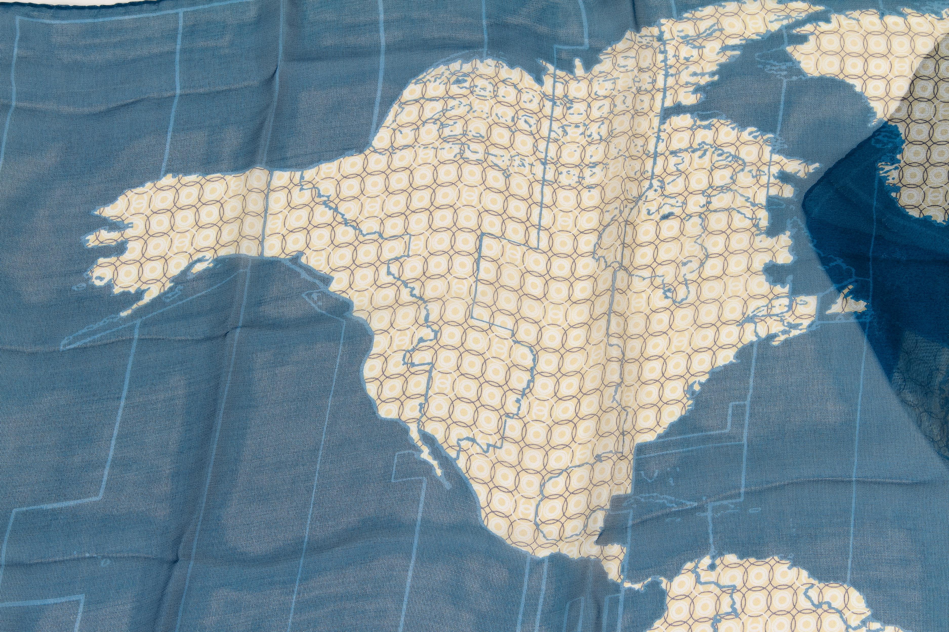 Chanel World Map blue white silk and linen scarf with small Chanel Logos. Measurements 66 L x 23 H
