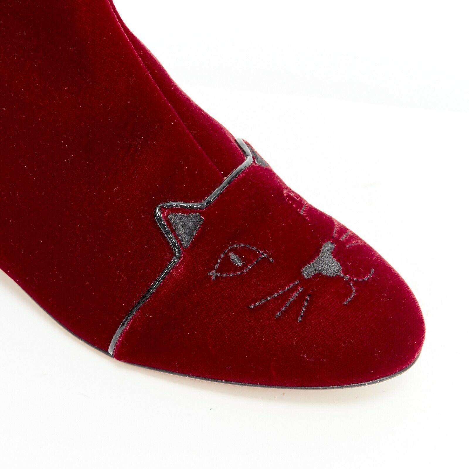new CHARLOTTE OLYMPIA red Velvet Puss kitty embroidery flat ankle boot EU37.5
CHARLOTTE OLYMPIA
Velvet Puss boots. 
Red velvet upper. 
Black thread signature Kitty face embroidery at toe cap. 
Round toe. 
Tonal stitching. 
Black patent piping