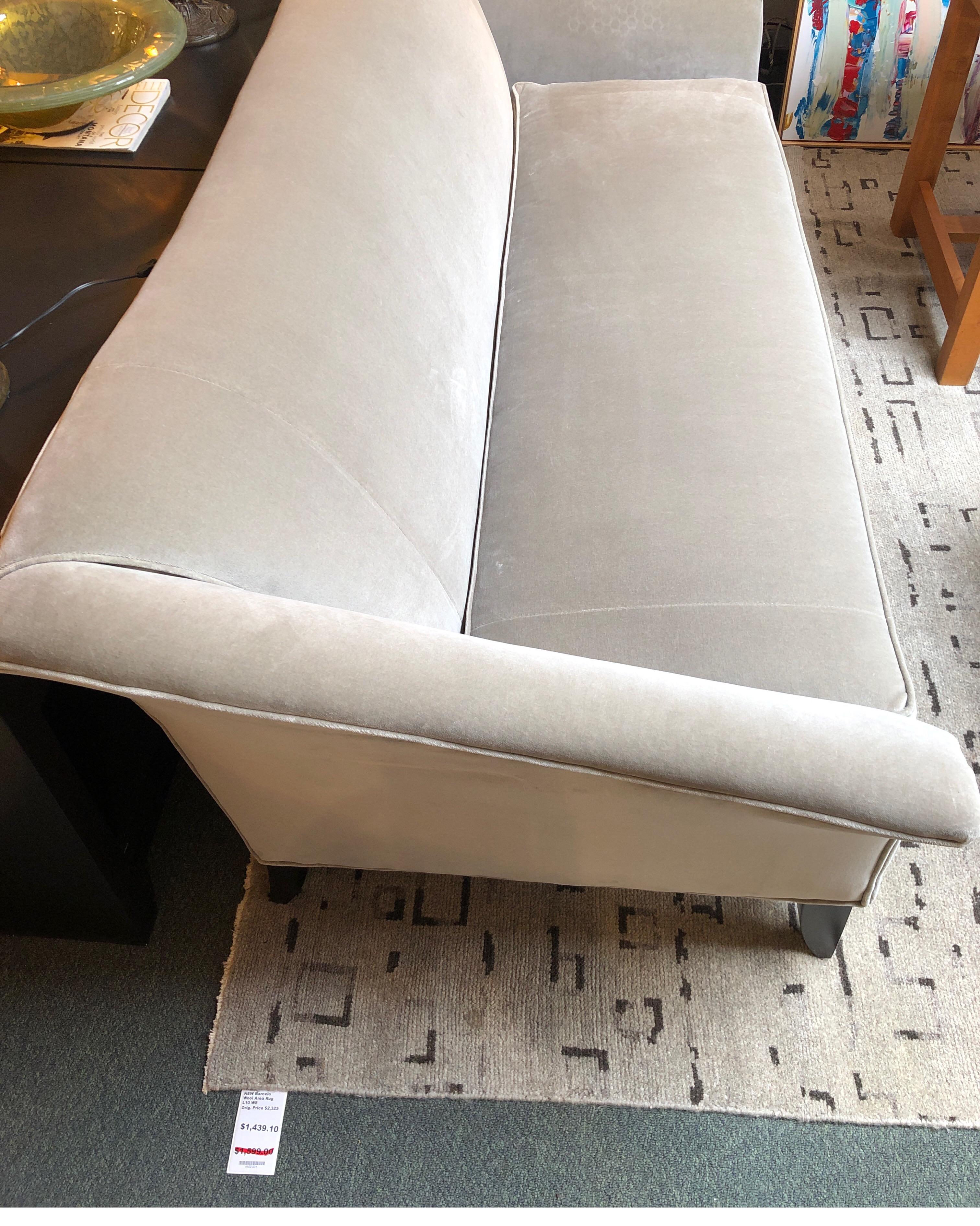 Design Plus Gallery presents a new sofa from Michael Thomas & Company. The charlotte, elegantly clad in dove gray velvet, references Biedermeier style in its curving arms and legs. The bench cushion, with tie Downs, is down wrapped foam.

Orig.