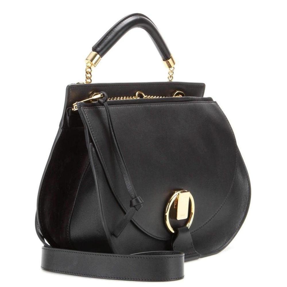 Another covetable shape from the house of Chloé: the 'Goldie' shoulder bag. The saddle-inspired design taps into the retro vibe of the season and is complemented by unique gold-tone hardware. Carry it by the chic top handle or opt for the adjustable