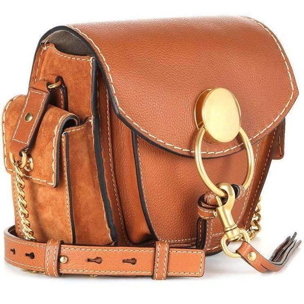 Lightly grained calf leather shoulder bag in caramel.

 Adjustable leather and curb chain shoulder strap with post-stud fastening. 

Patch pocket at face. 

Flap compartment with magnetic press-stud fastening at suede sides. 

Foldover flap