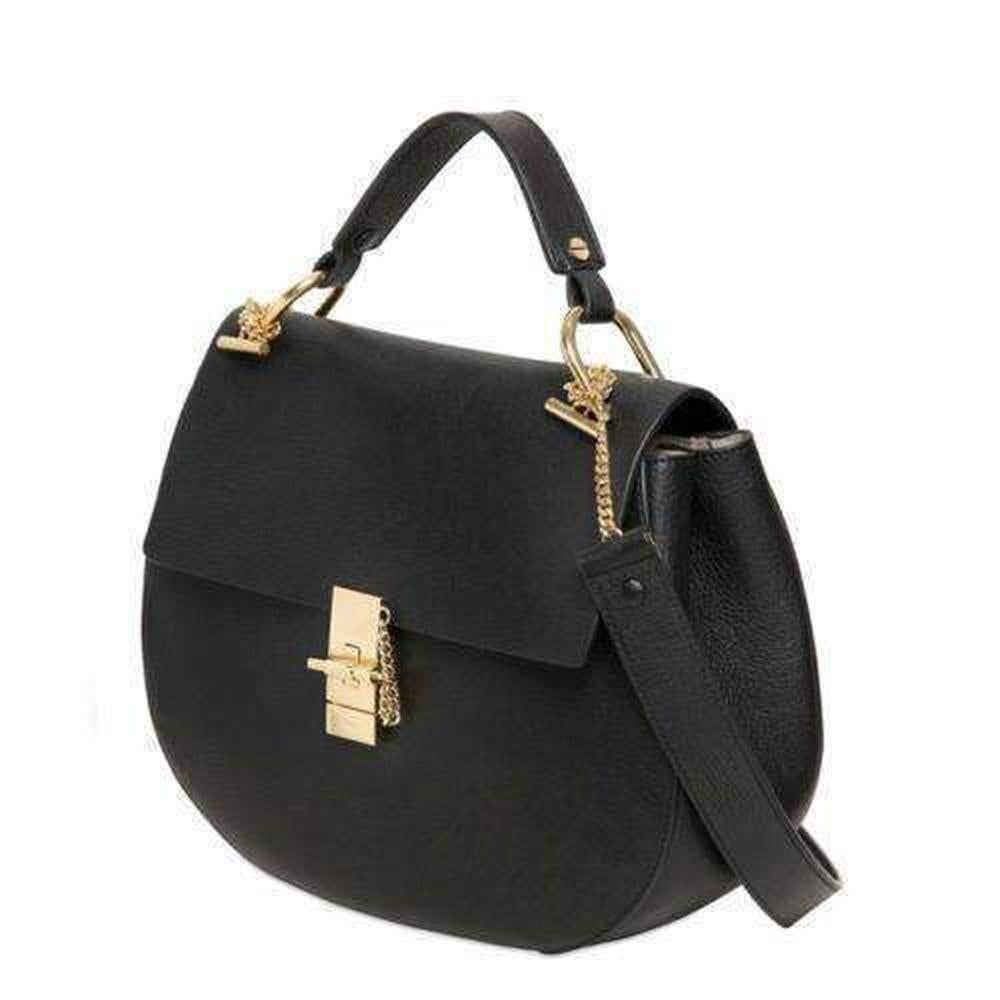 Black lamb skin large 'Drew' satchel from Chloé featuring a foldover top with push-lock closure, gold-tone hardware, a top handle, an adjustable shoulder strap, an internal zipped pocket, an internal logo stamp, a pebbled leather texture and a suede