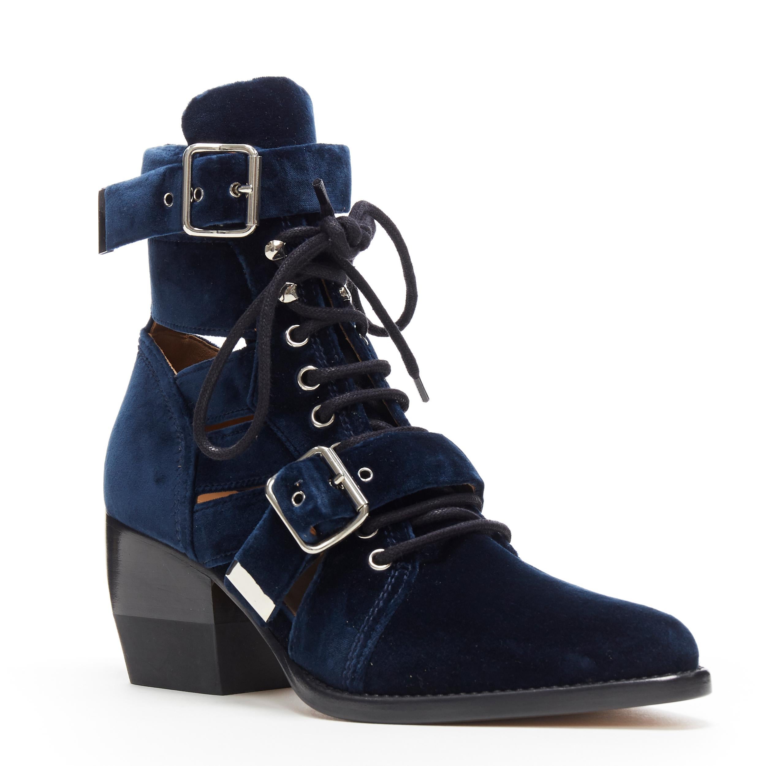 new CHLOE Rylee blue velvet buckle strap lace up cut out ankle boots EU37
Brand: Chloe
Model Name / Style: Rylee boots
Material: Velvet
Color: Blue
Pattern: Solid
Closure: Lace up
Lining material: Leather
Extra Detail: Mid (2-2.9 in) heel height.