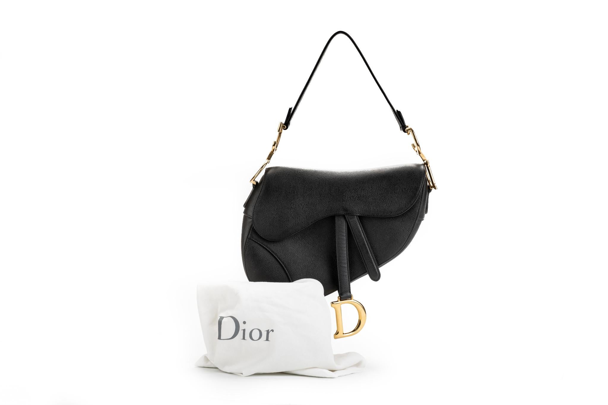 Christian Dior brand new black calfskin saddle bag with gold tone hardware. Comes with serial number and original dust cover.
